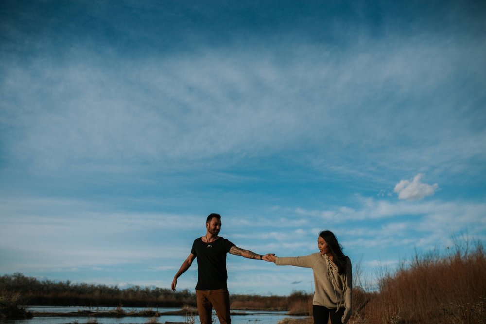  I loved working with Xamie and Nate on this incredible couples portrait session at the Alameda Bosque Open Space in Albuquerque, New Mexico. Our session started off with grey overcast skies that made for some moody portraits! Xamie and Nate’s outfit