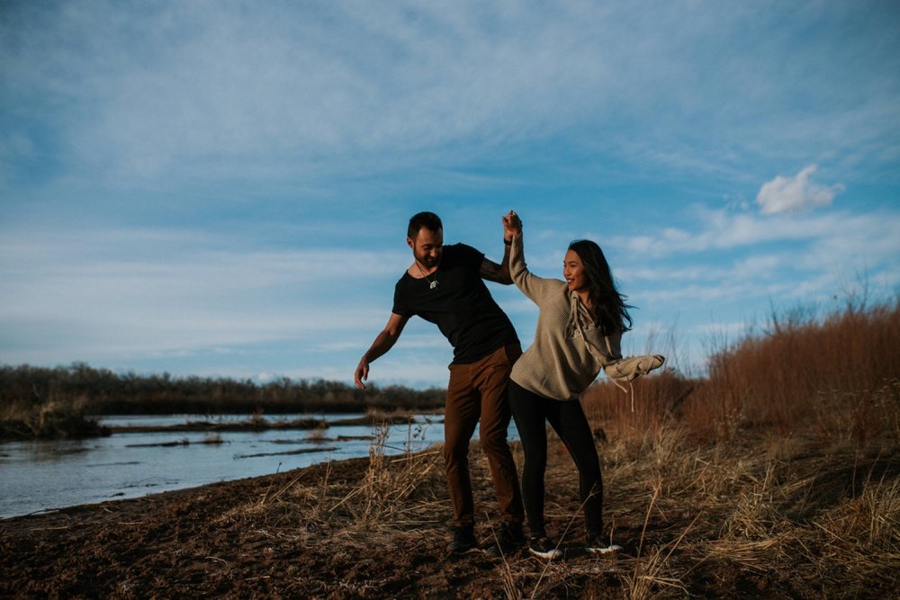  I loved working with Xamie and Nate on this incredible couples portrait session at the Alameda Bosque Open Space in Albuquerque, New Mexico. Our session started off with grey overcast skies that made for some moody portraits! Xamie and Nate’s outfit