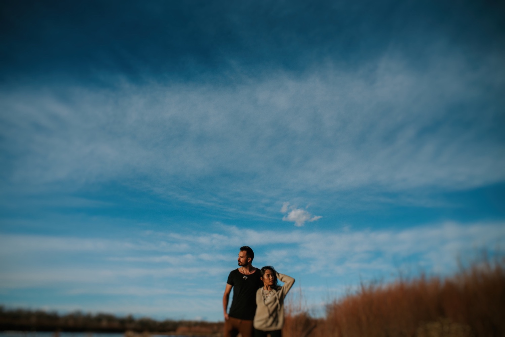  I loved working with Xamie and Nate on this incredible couples portrait session at the Alameda Bosque Open Space in Albuquerque, New Mexico. Our session started off with grey overcast skies that made for some moody portraits! Xamie and Nate’s outfit