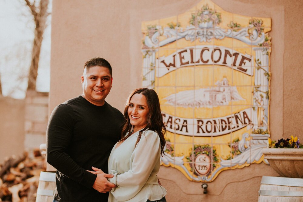  Natalie and Branden are the absolute cutest and I loved exploring through Casa Rondeña Winery in Los Ranchos de Albuquerque, New Mexico to capture their incredible winter engagement photos. Natalie looked stunning in her mint blouse and jeans which 