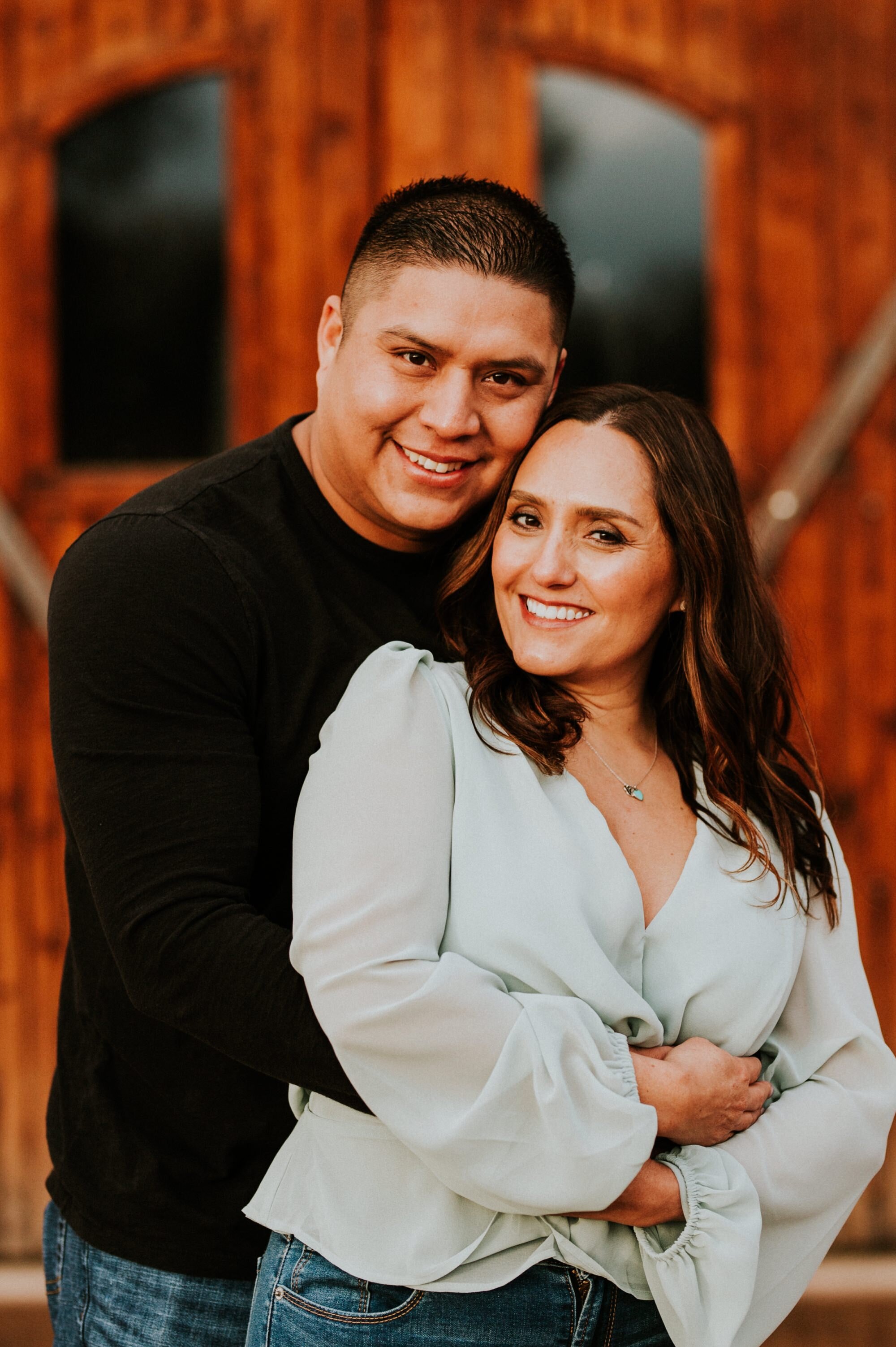  Natalie and Branden are the absolute cutest and I loved exploring through Casa Rondeña Winery in Los Ranchos de Albuquerque, New Mexico to capture their incredible winter engagement photos. Natalie looked stunning in her mint blouse and jeans which 