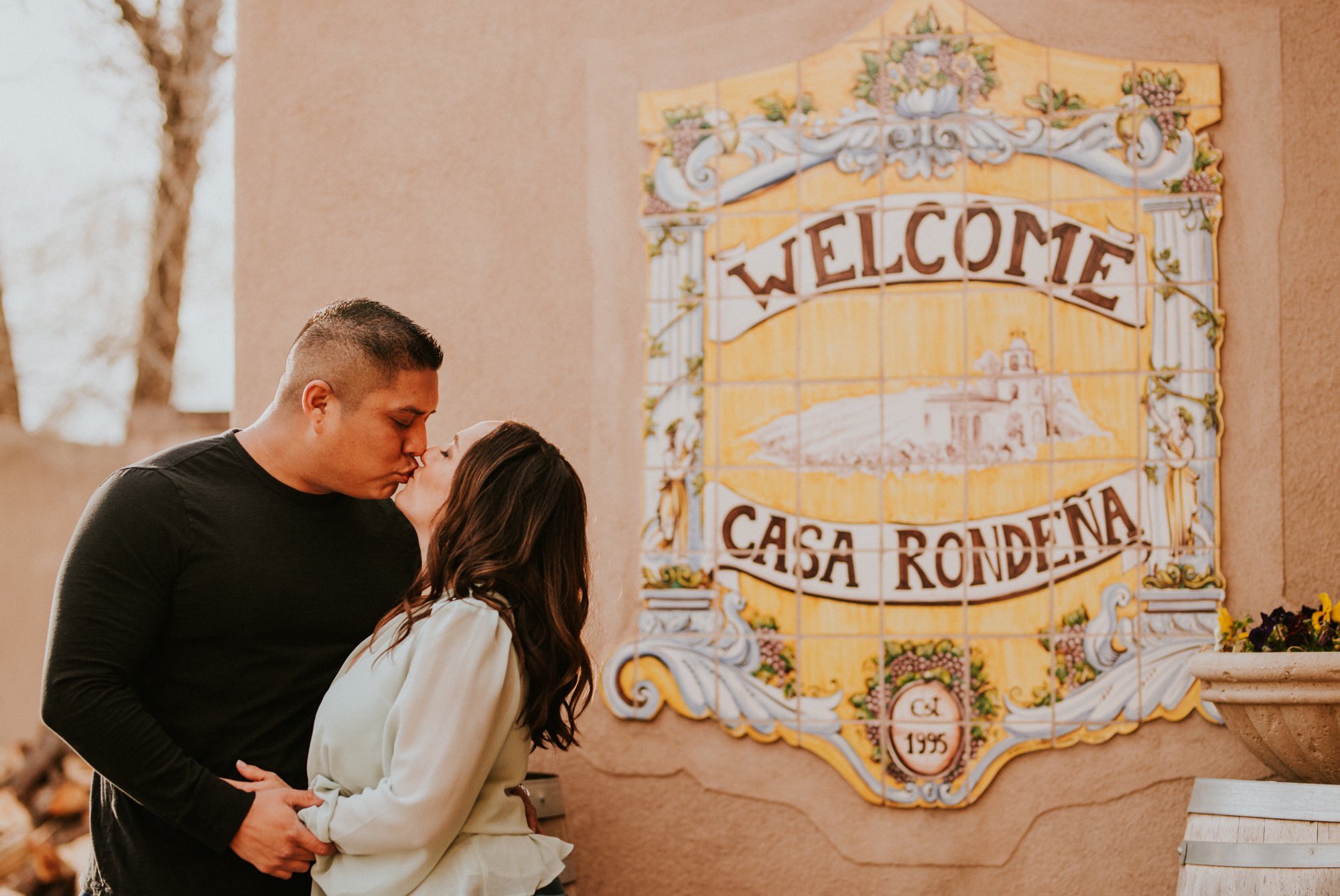  Natalie and Branden are the absolute cutest and I loved exploring through Casa Rondeña Winery in Los Ranchos de Albuquerque, New Mexico to capture their incredible winter engagement photos. Natalie looked stunning in her mint blouse and jeans which 