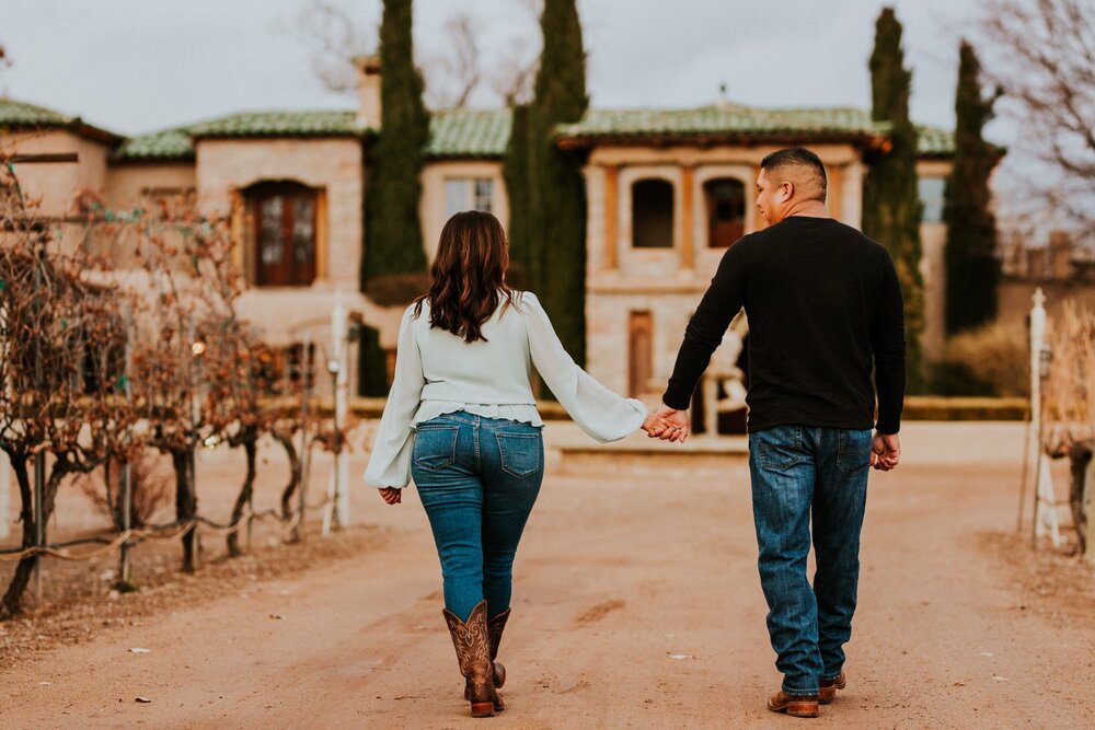  Natalie and Branden are the absolute cutest and I loved exploring through Casa Rondeña Winery in Los Ranchos de Albuquerque, New Mexico to capture their incredible winter engagement photos. Natalie looked stunning in her mint blouse and jeans which 