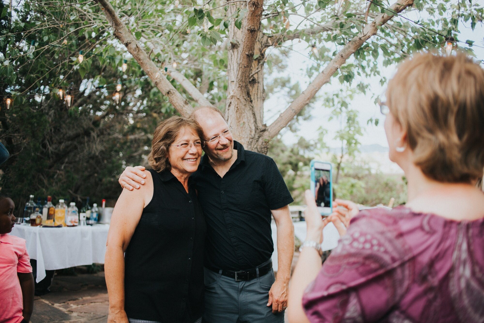 Katie and Frankie had one of the greatest Santa Fe rehearsal dinners that I have ever photographed. I loved that they chose an Italian dinner party theme for their rehearsal dinner at their family’s home in Santa Fe, New Mexico. From the red and whi