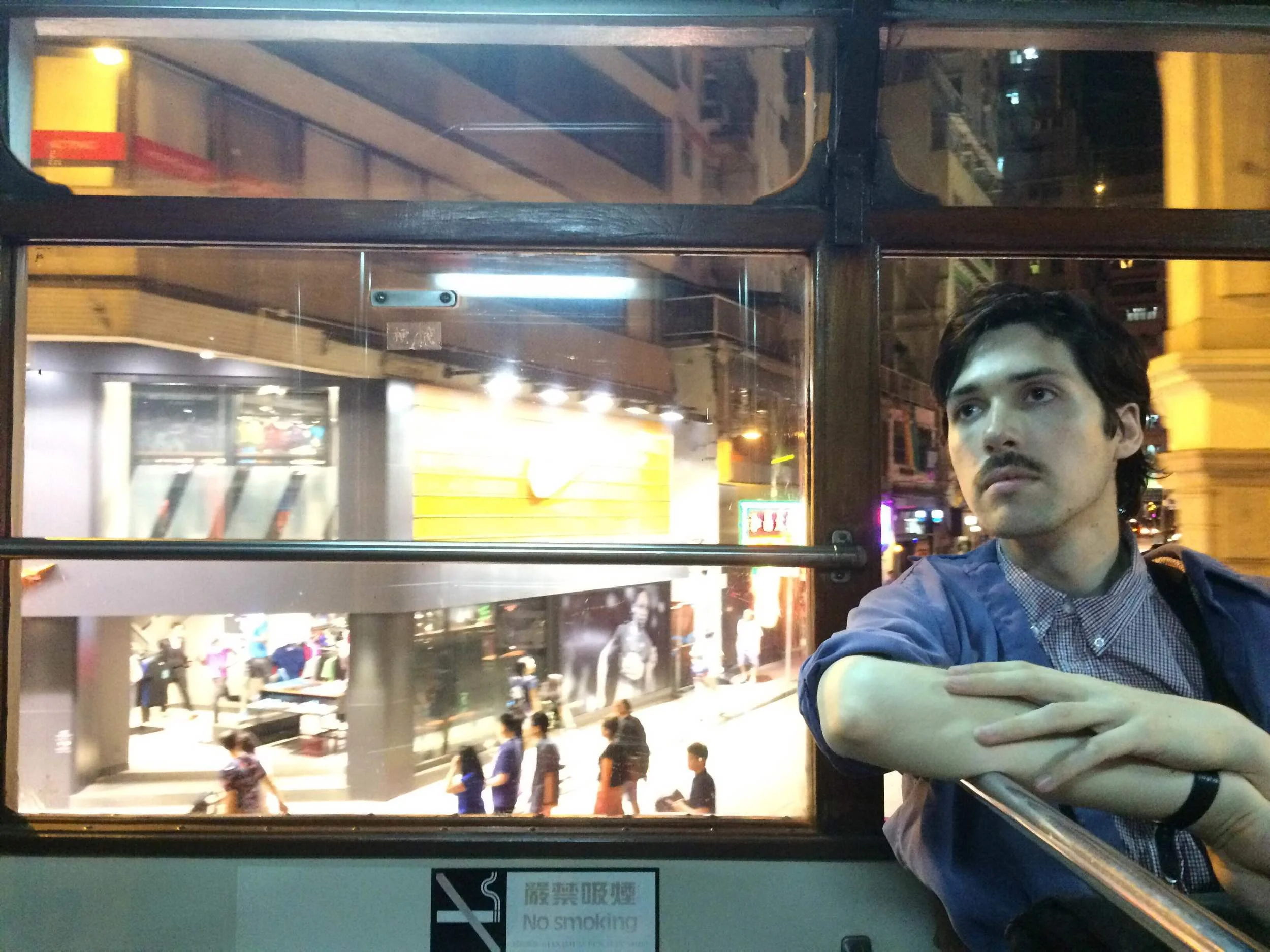 Adam very casually enjoying an evening tram ride. 