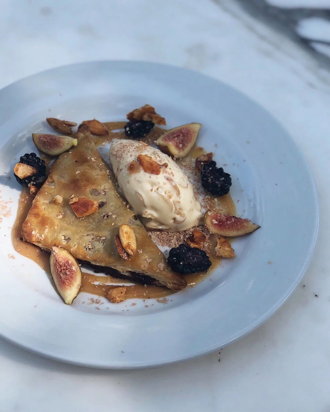 blackberry handpie • toasted almond ice cream • caramel almonds • burnt soy honey • blackberries • figs • bran flakes