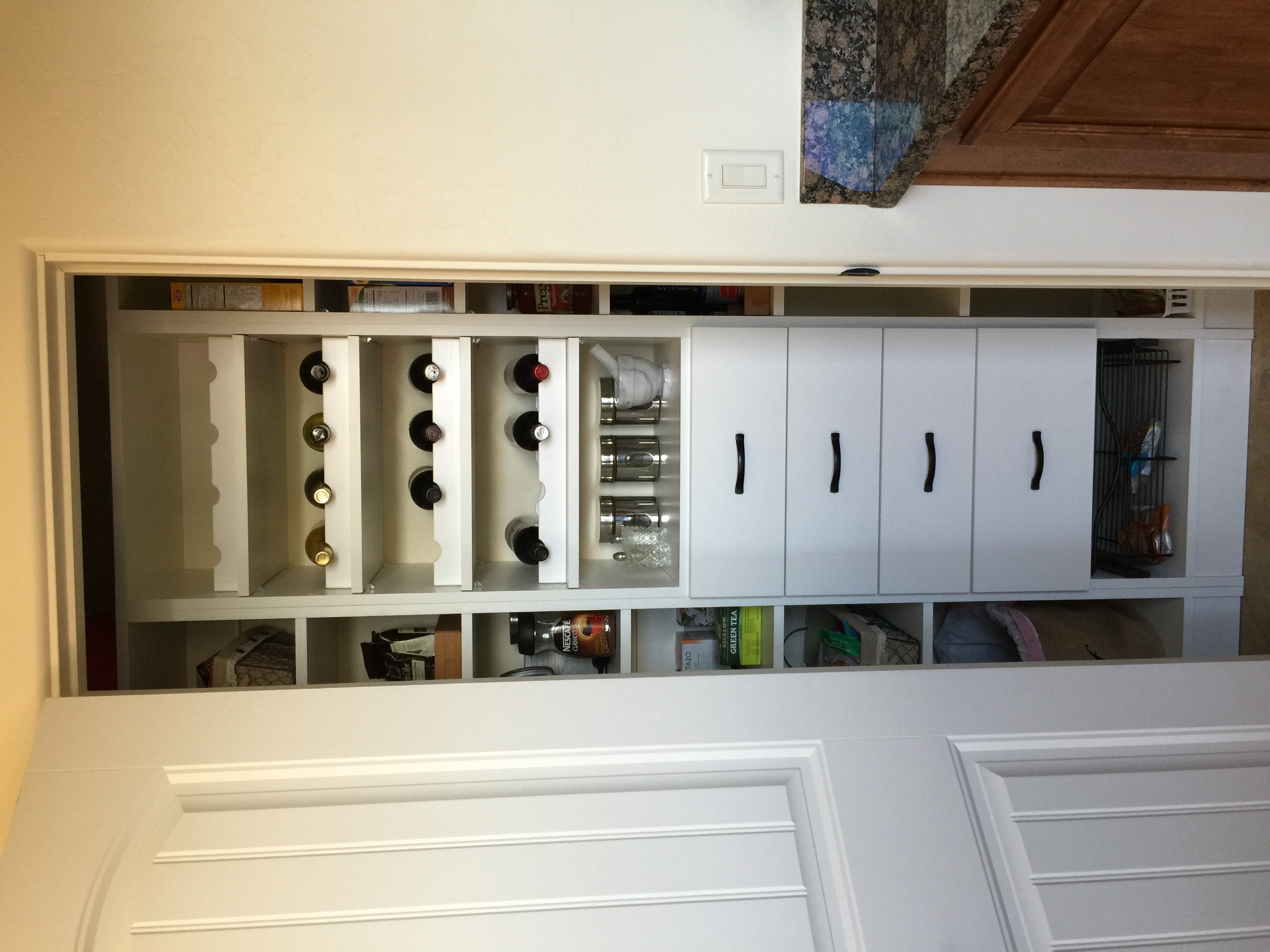 Pantry with shelves and wine racks