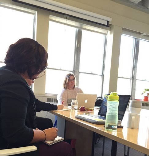 Ociciwan Core Members taking notes as they listen to facilitator, Sky Godden