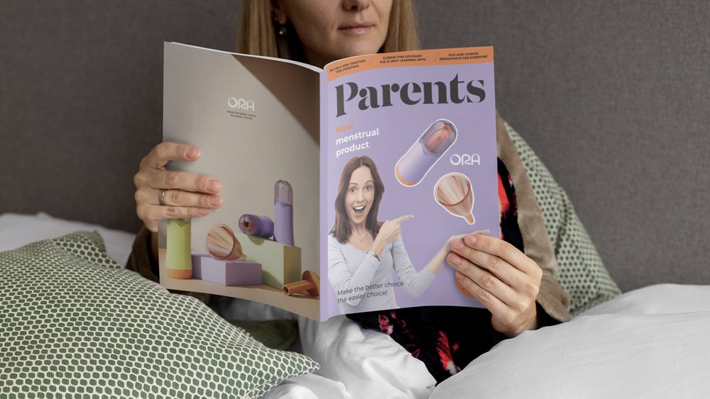  ORA branding: a woman is reading a magazine called “Parents” with a purple cover 