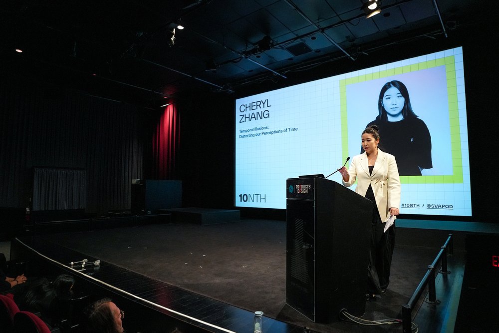  Speaker at podium with the title screen behind her featuring a photo of herself 