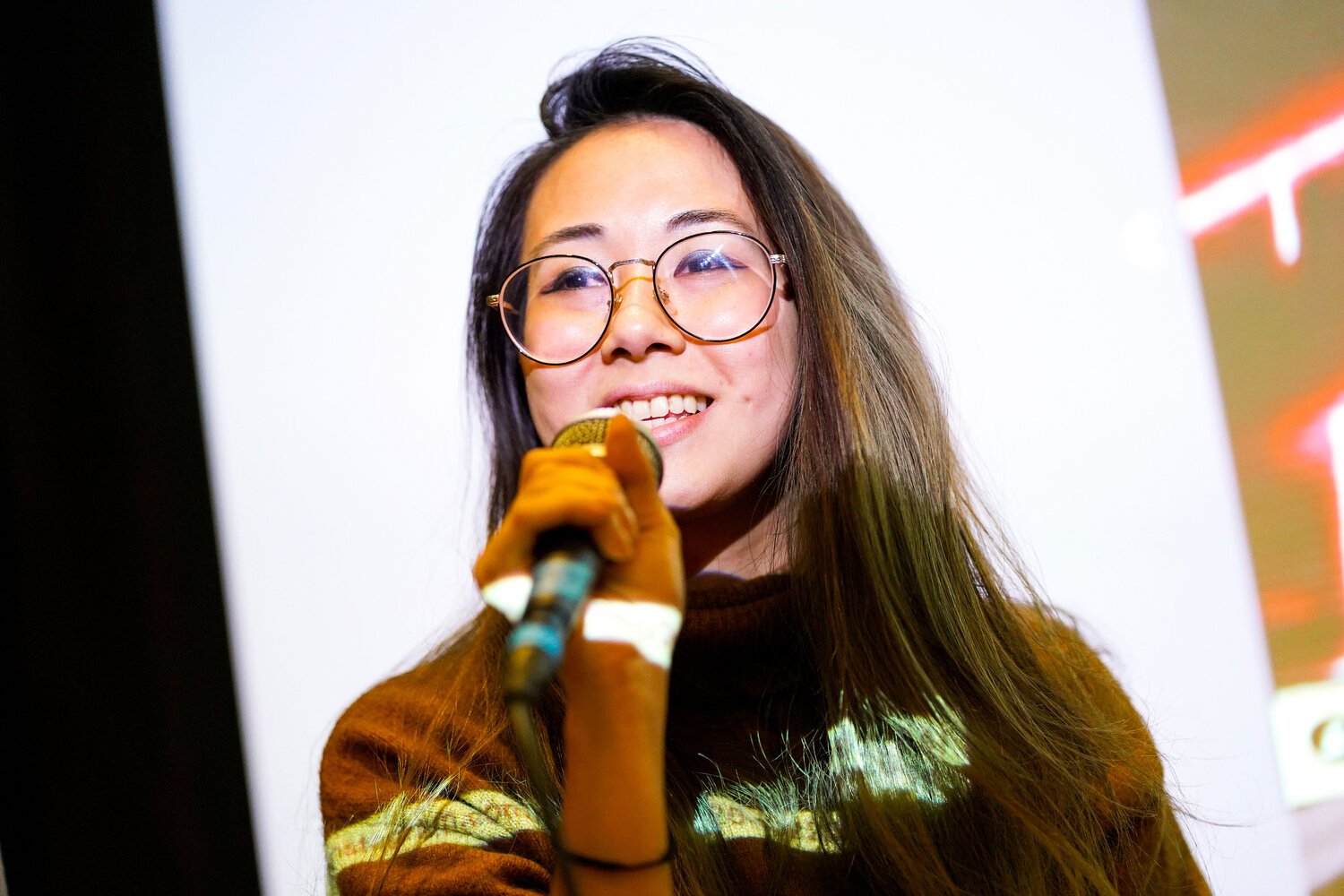  A student holds a microphone during a previous info session  