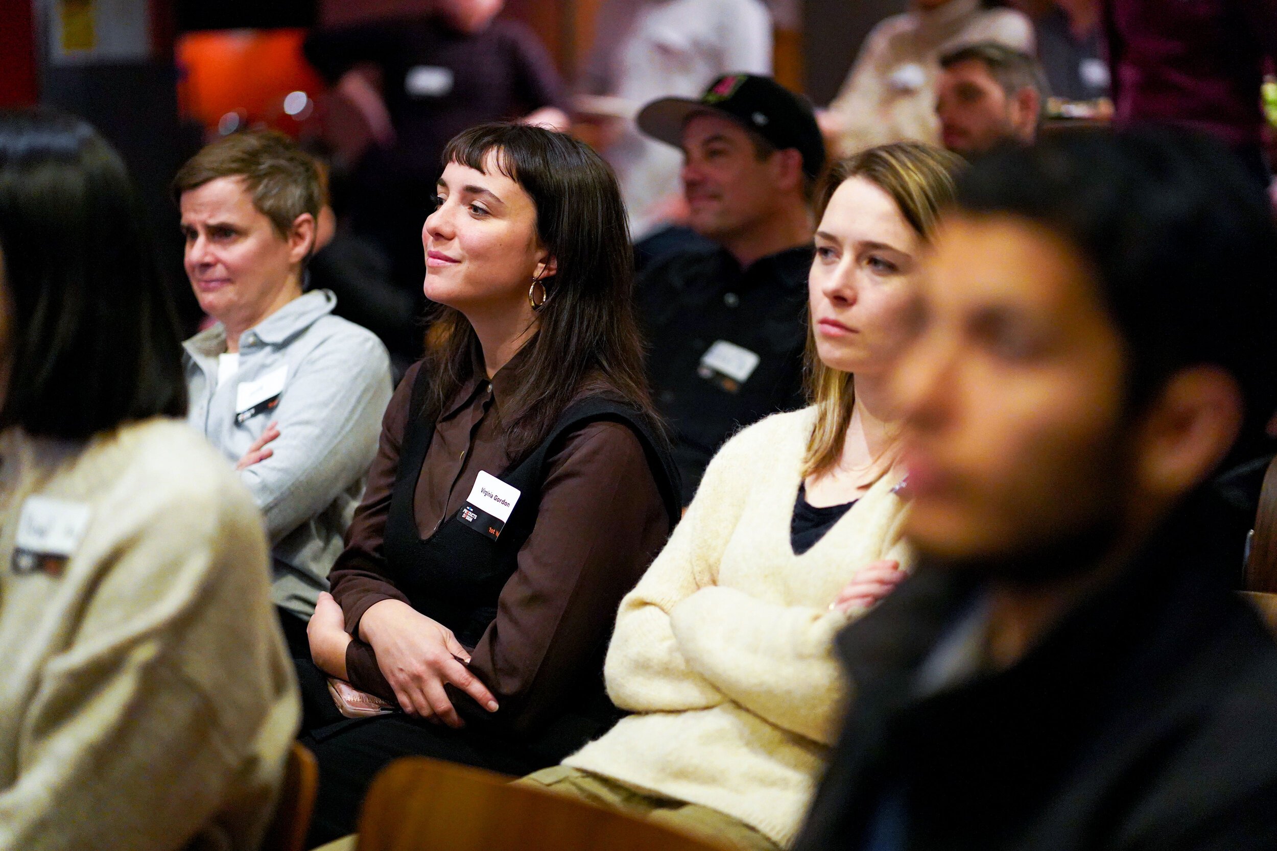  A crowd of prospective students are listening in the audience  