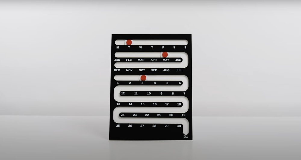  Perpetual Sliding Calendar featuring a maze-like path for a red dot to slide down, showing the current date 