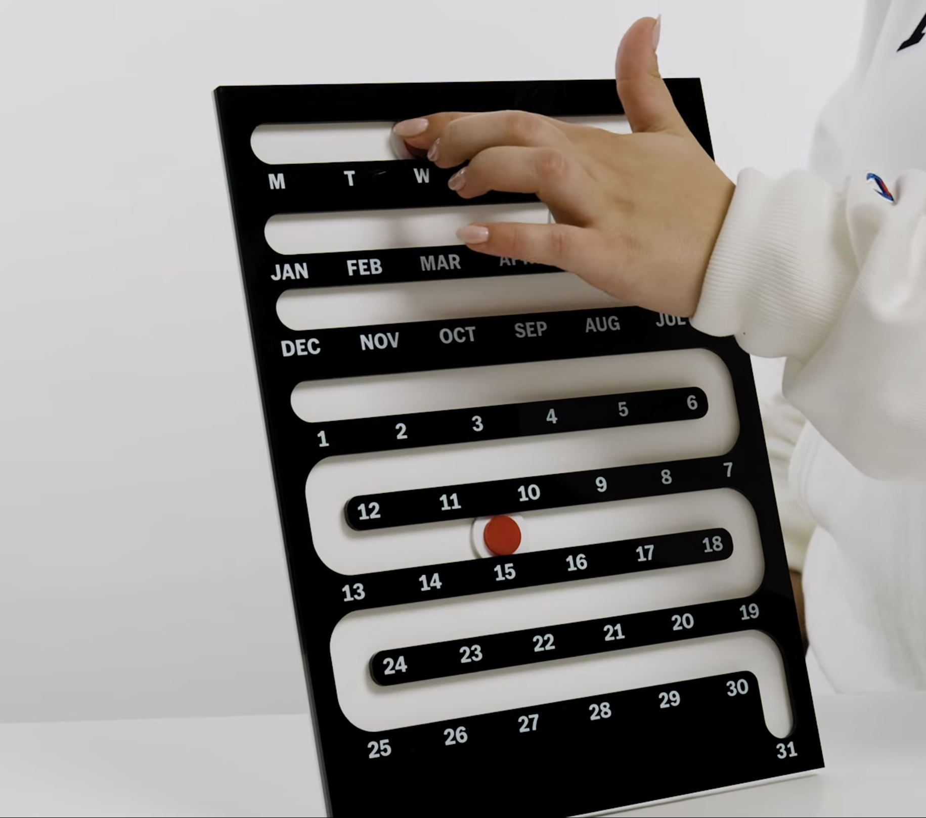  Perpetual Sliding Calendar featuring a maze-like path for a red dot to slide down, showing the current date 