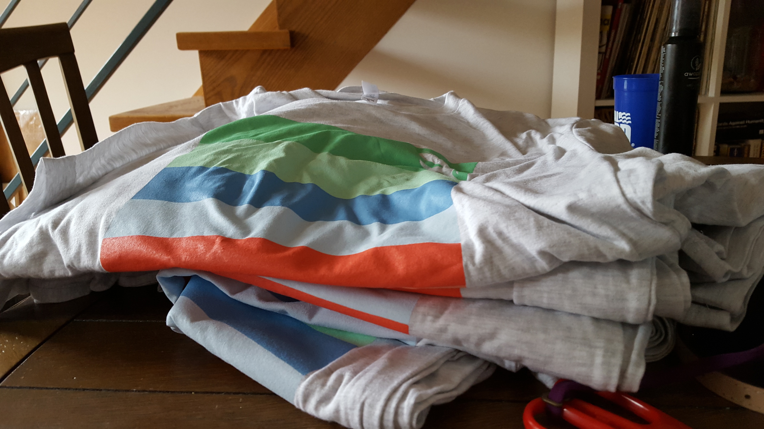 Our massive pile of shirts just picked up from the printer!