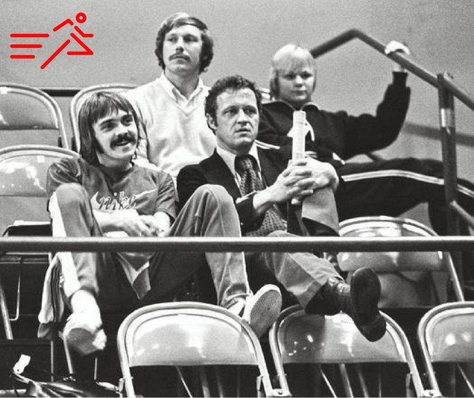 Coach and Olympian, Bill Dellinger (right; front) seated next to one of his runners, Olympian Steve Prefontaine (left; front).