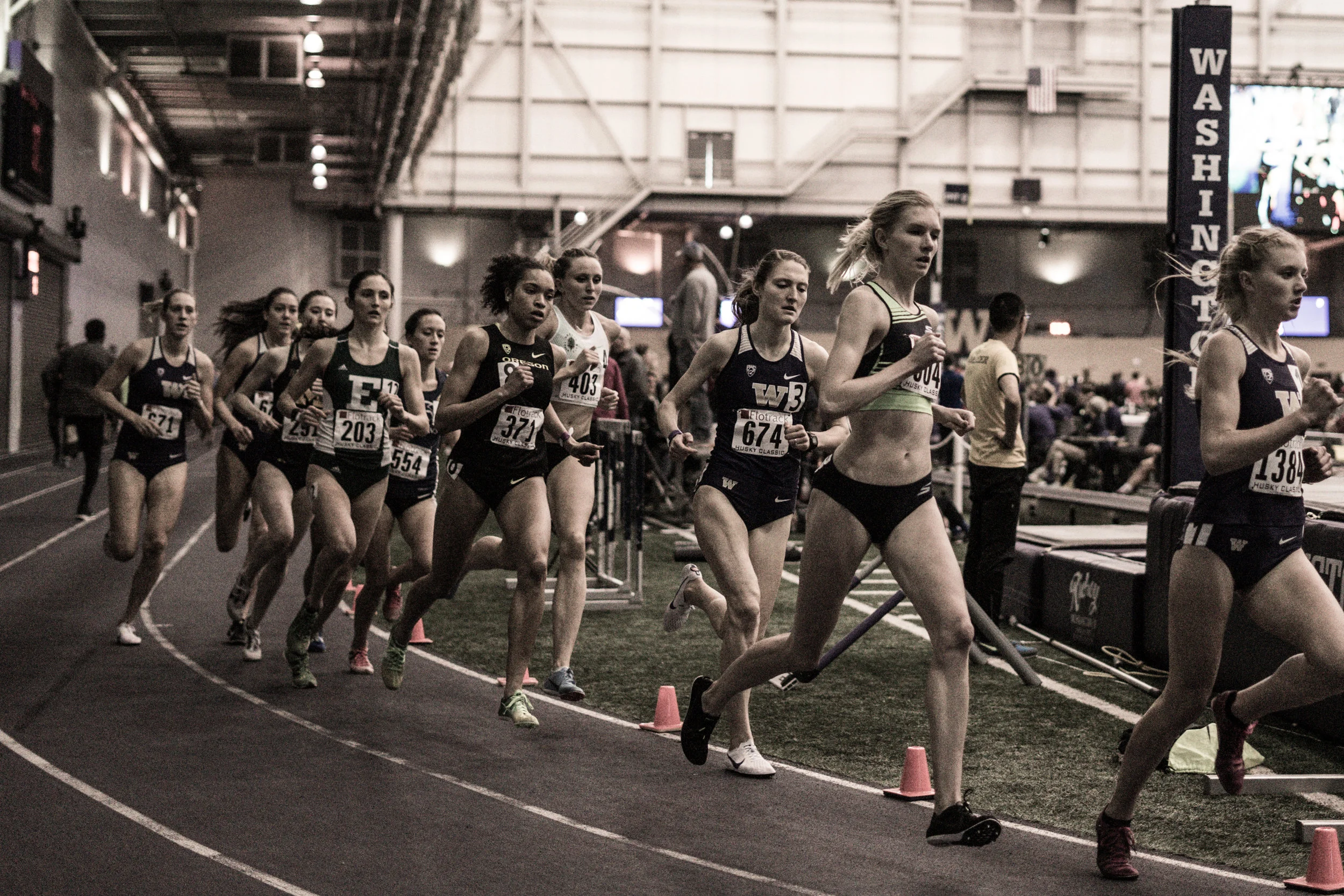 Eleanor Fulton (2nd from right) en route to a personal best mark of 4:34 in the indoor 1 Mile at the 2018 Husky Classic.