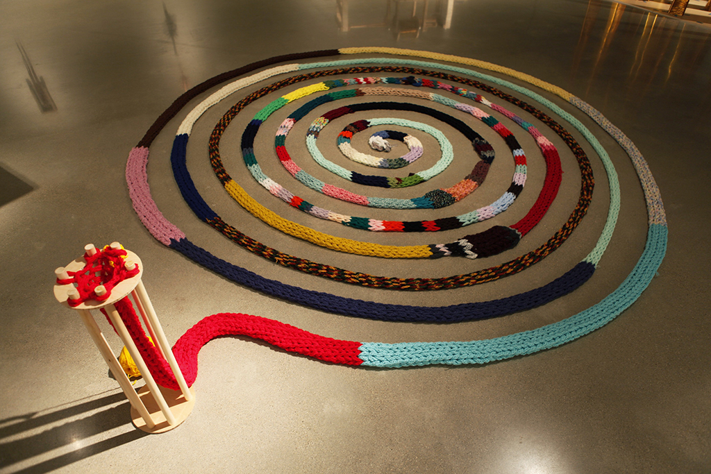 (10)Mallory Donen_The Machine_Knitting Ouroboros_13ft Wide.jpg