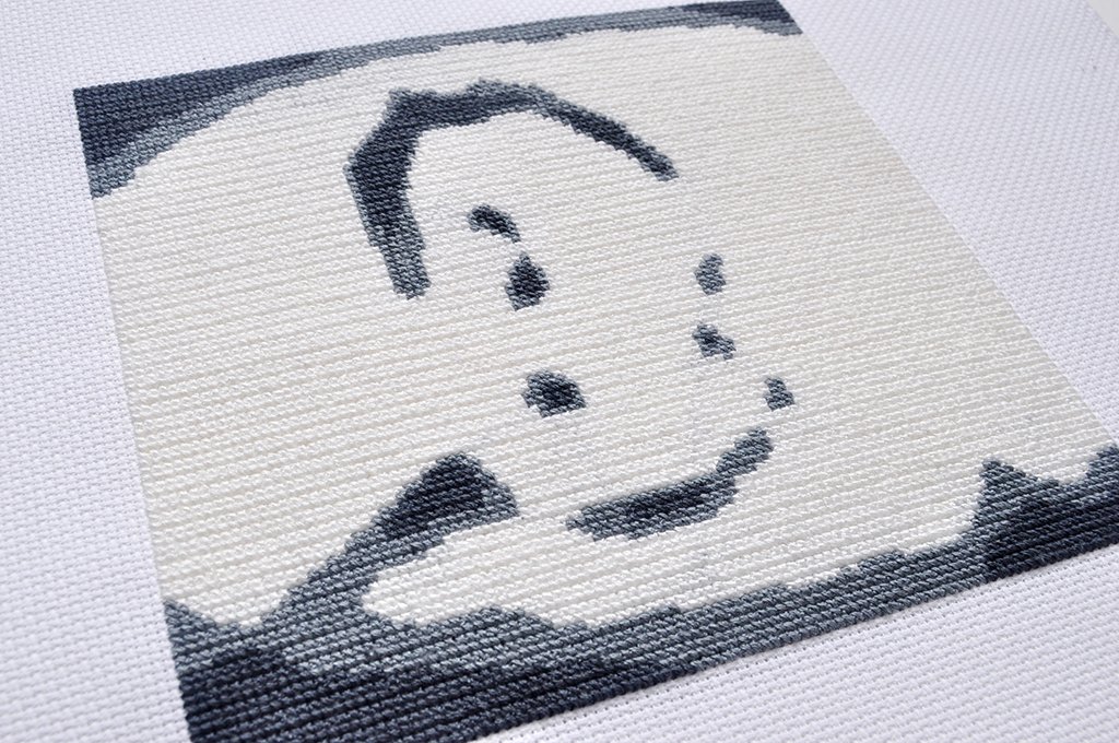  (Detail)  Becoming a Pixel - Portrait 3/5 , 2022, embroidery floss, Aida cloth⁠, 7 x 7 inches, 31.25 hours of labour 