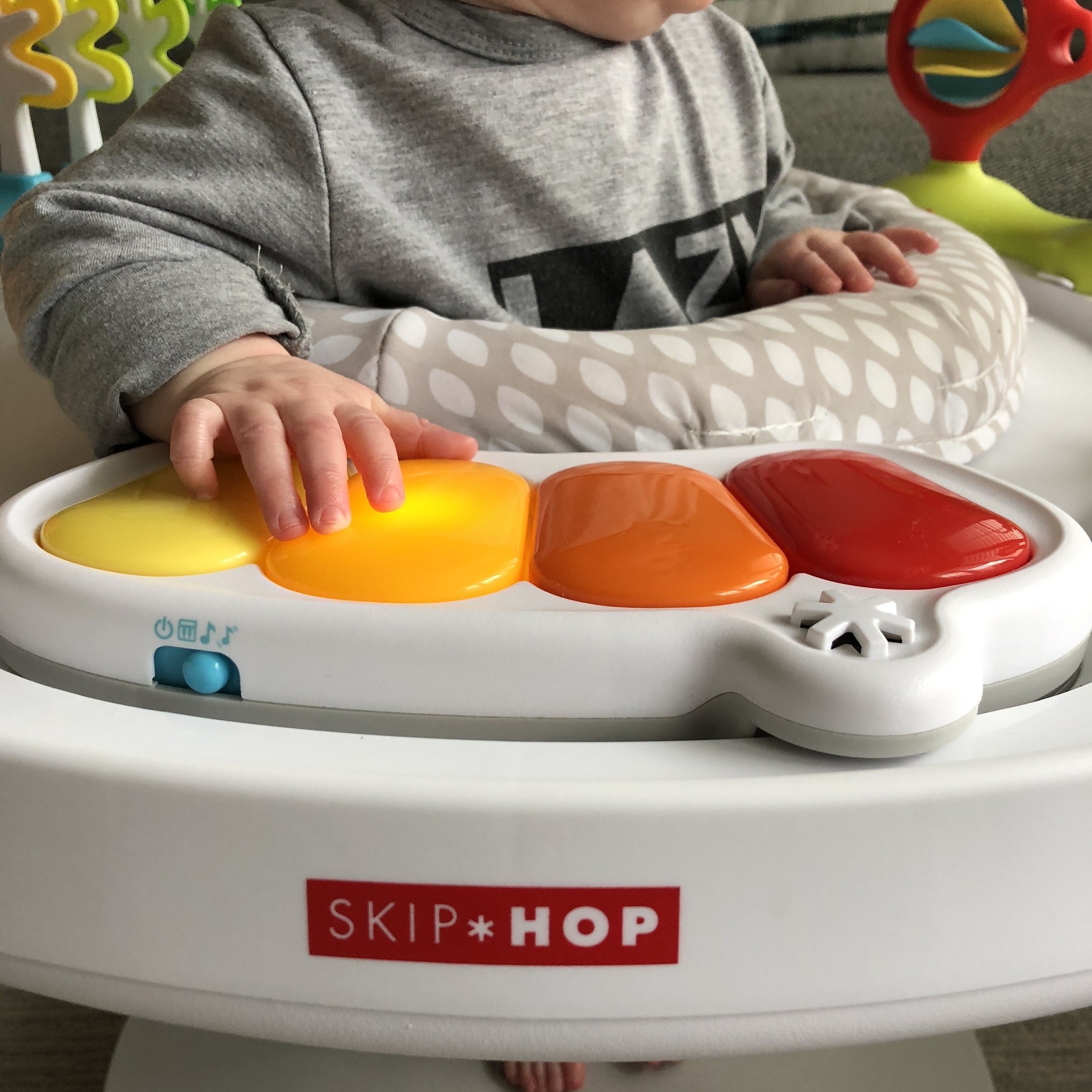 skip hop activity center clip on toys