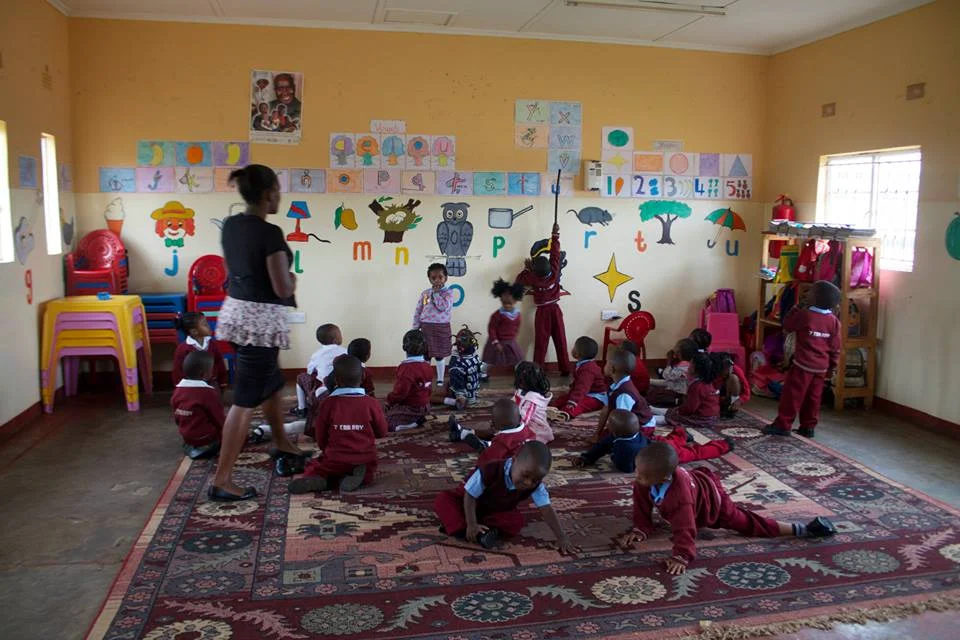Wassisi (teacher) with the youngest class : ages 3-5yrs