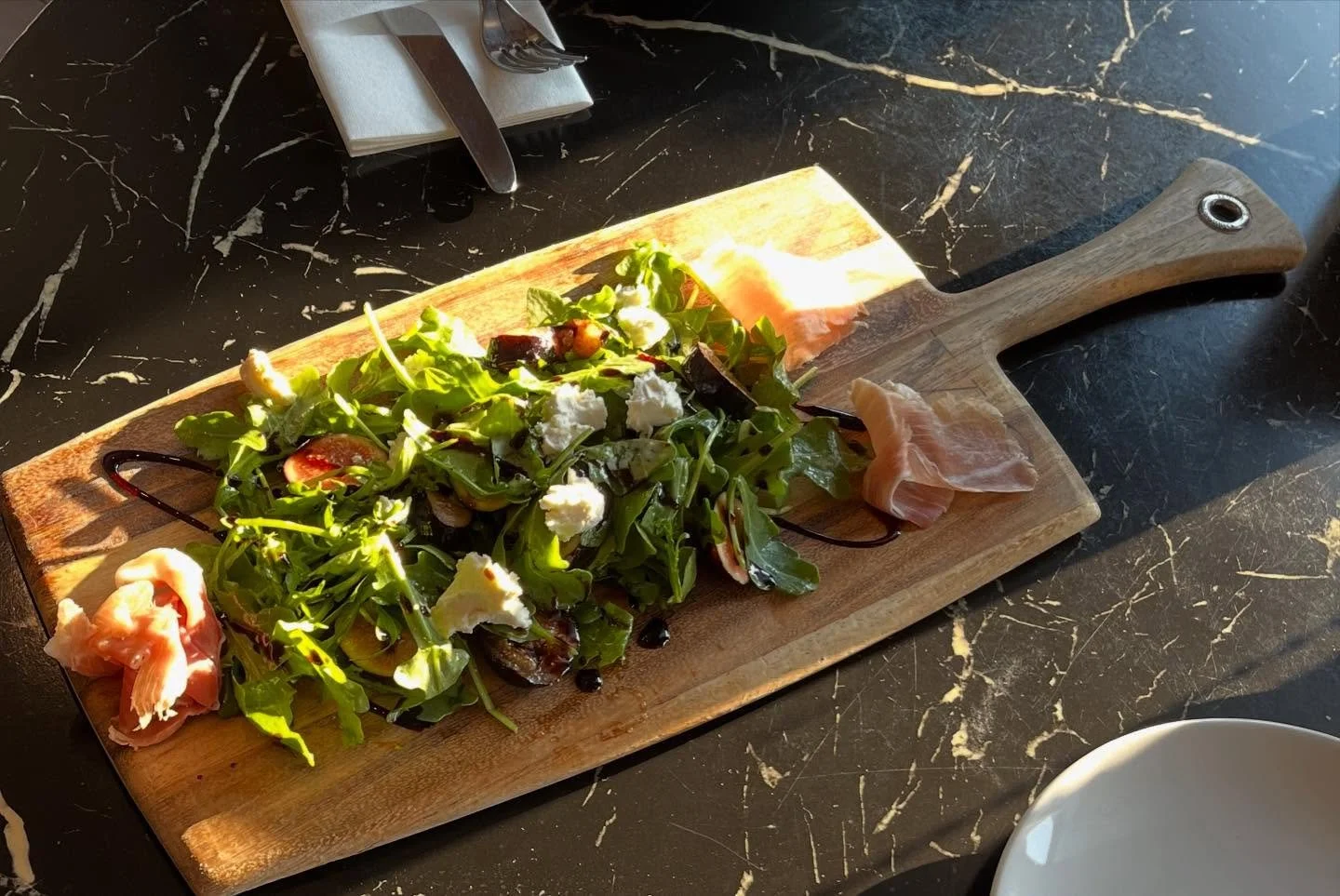 Weekly Special: Figs and arugula salad with creamy goat cheese, prosciutto, and a balsamic drizzle! A perfect fall treat! 🍁