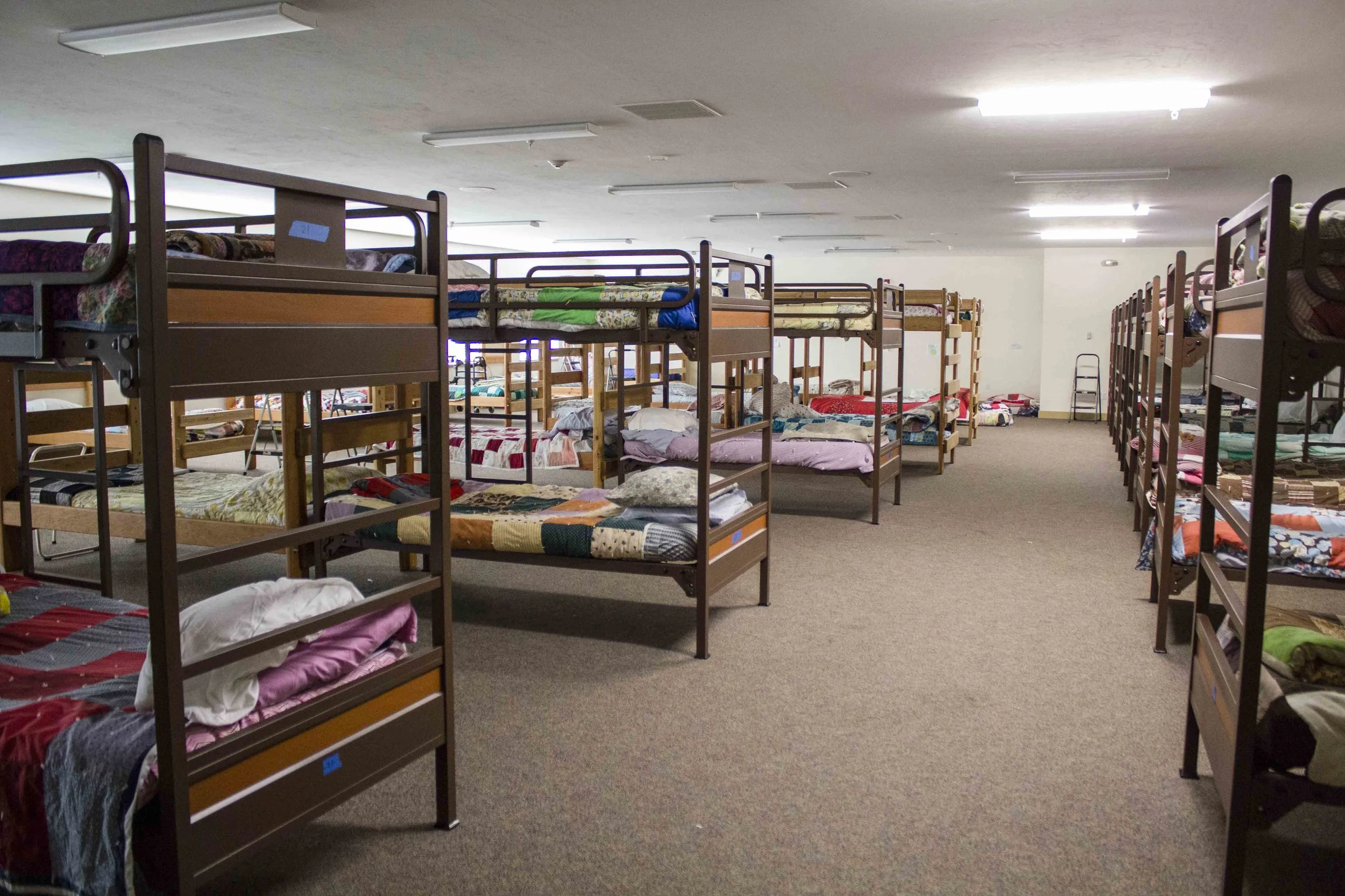 This is the women's room. The fun quilts are all hand made and donated by a local church.