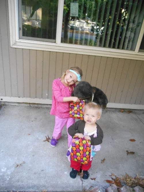 Off to boo our neighbors! (Gorilla wanted to come along too) If you look closely, you can see our ghost in the window showing that we've been booe'd.