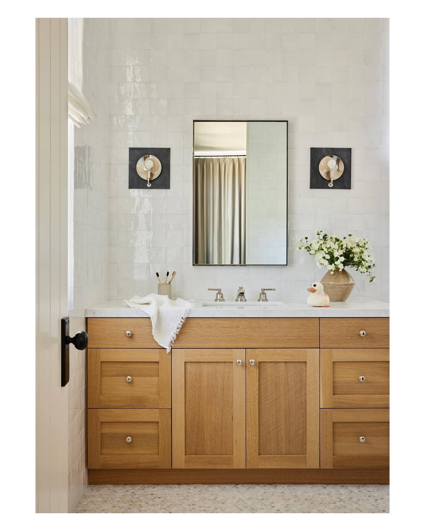 With two adorable and rambunctious little boys my client asked for &ldquo;chic but wipeable&rdquo; (the eternal family design brief? :) for her older sons bathroom so we tiled all the walls and did grey marble penny tiles on the floor. 

Interiors @l