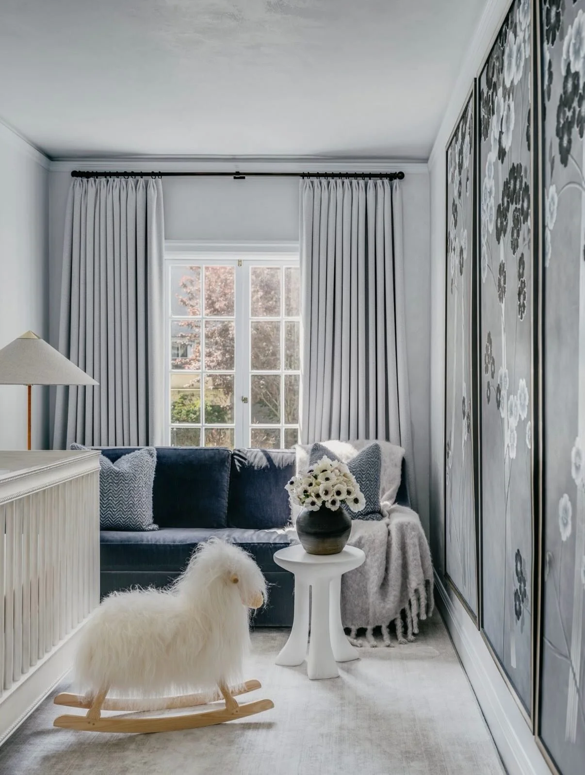 Powder blue plaster and @degournay anemones wrap this baby girls nursery in San Francisco that I designed back in 2020.  In honor of her name we hid three lilies in one of the panels (can you find them on slide 3?). Designing kids rooms is the joy of
