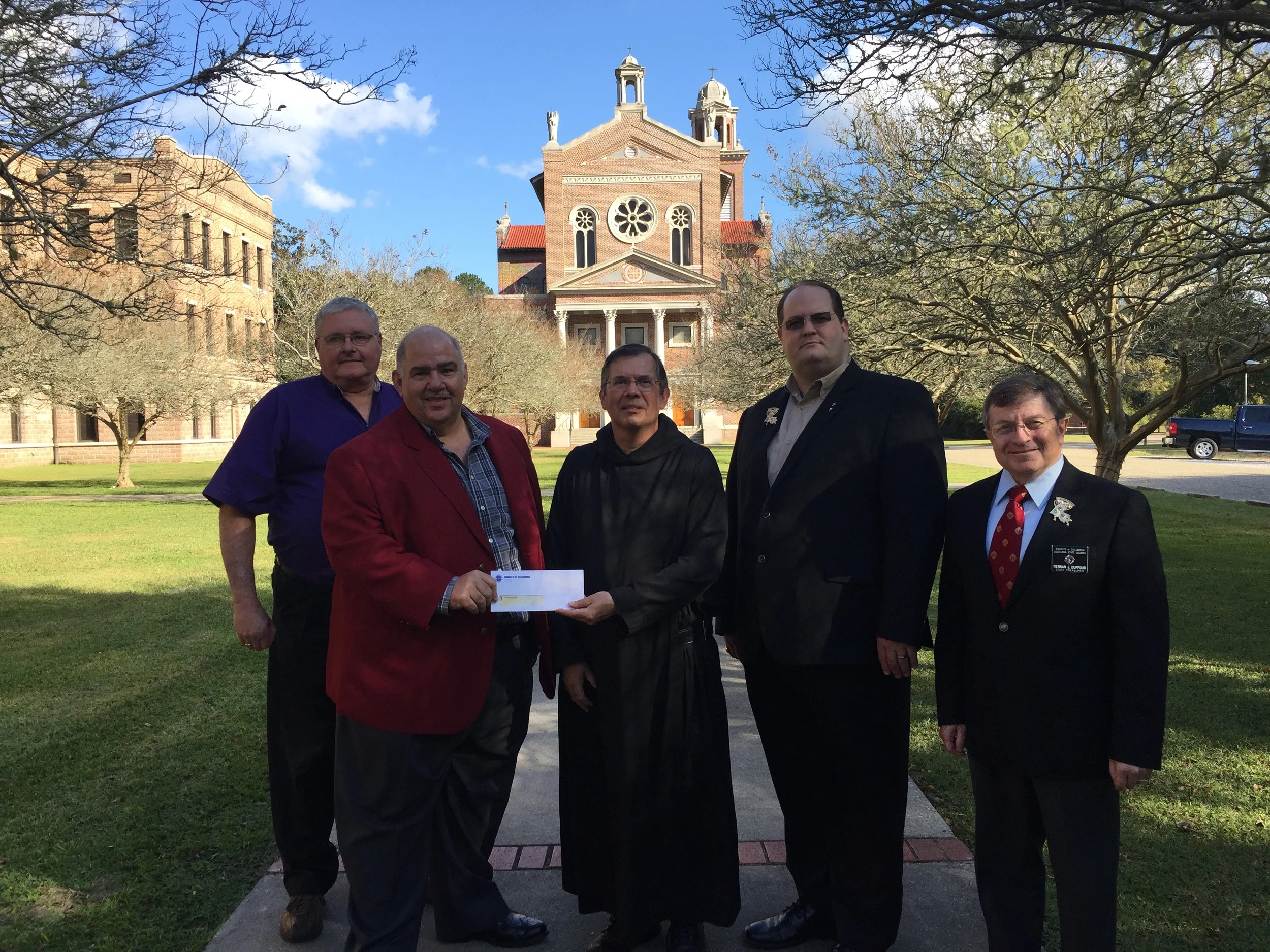 Saint Joseph Seminary College was presented a check for $20,000 from members of the Knights of Columbus Louisiana State Council. The donation will be used for the seminary's mission immersion program. From left to right are Keith Lawson, state warden, Delmas Forbes, Jr., seminarian mission fund chairman, Fr. Jude Israel, O.S.B., dean of students at Saint Joseph, Vernon Ducote, state deputy and Rennan Duffour, state treasurer.