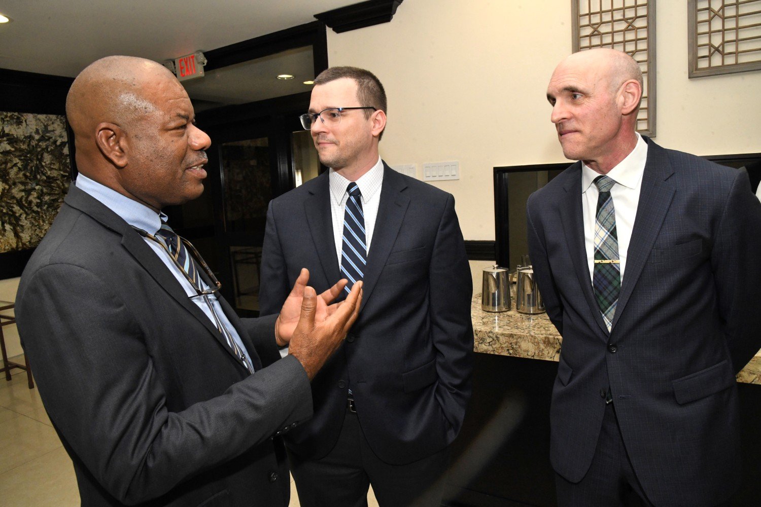 Calabar Principal Albert Corcho in discussion with Mark Wile( VP FACTS) and Mike Wright (Deputy Chief Security Officer, Nelnet)