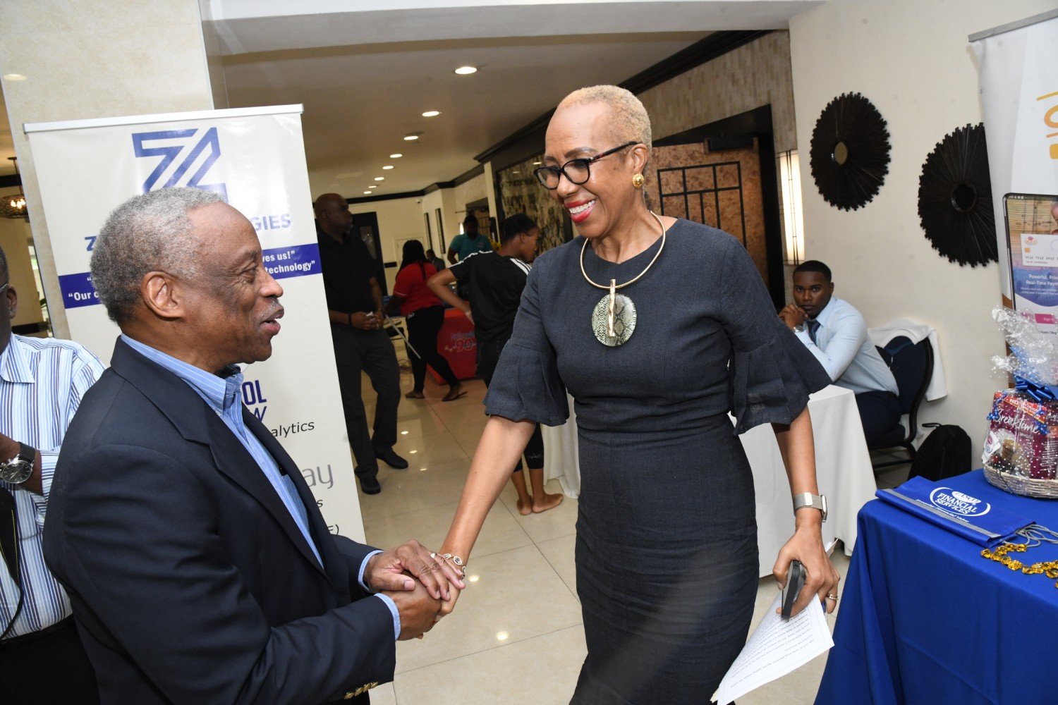 Milton Samuda greeting the Honourable Minister Fayval Williams- Minister of Education and Youth