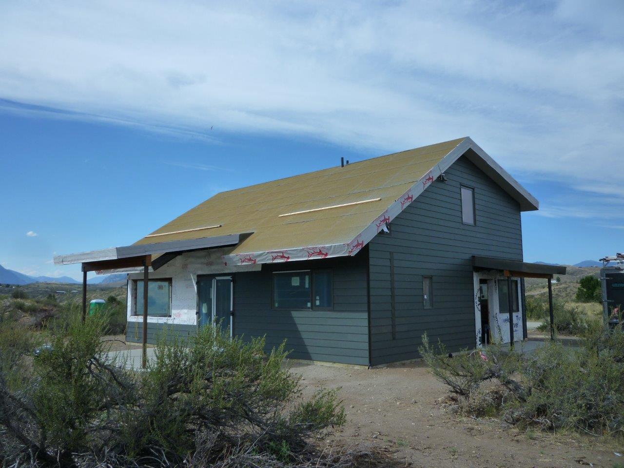 The south side of our zero-energy house, with covered porch.