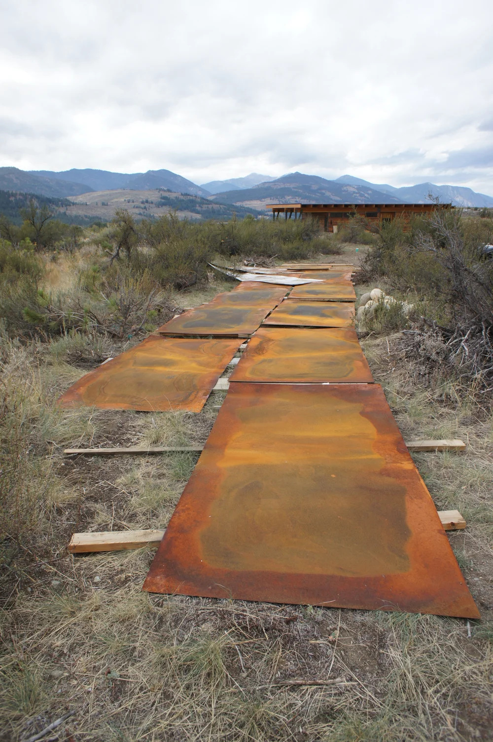  Steel plate that we rusted, ready to be installed as accent siding. 