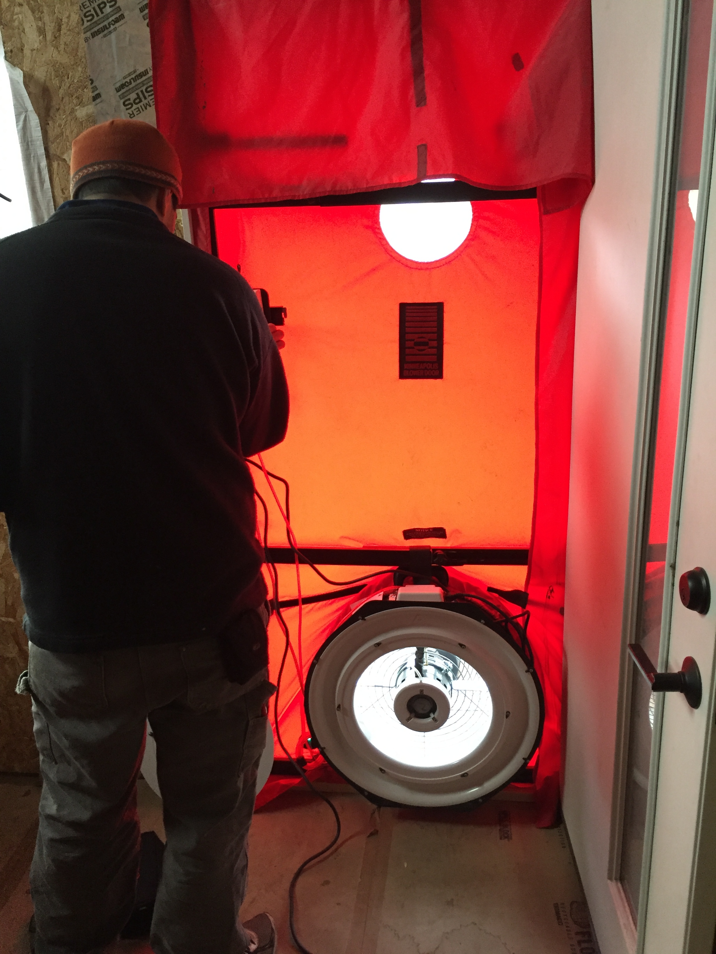 Dave adjusting the blower door equipment.