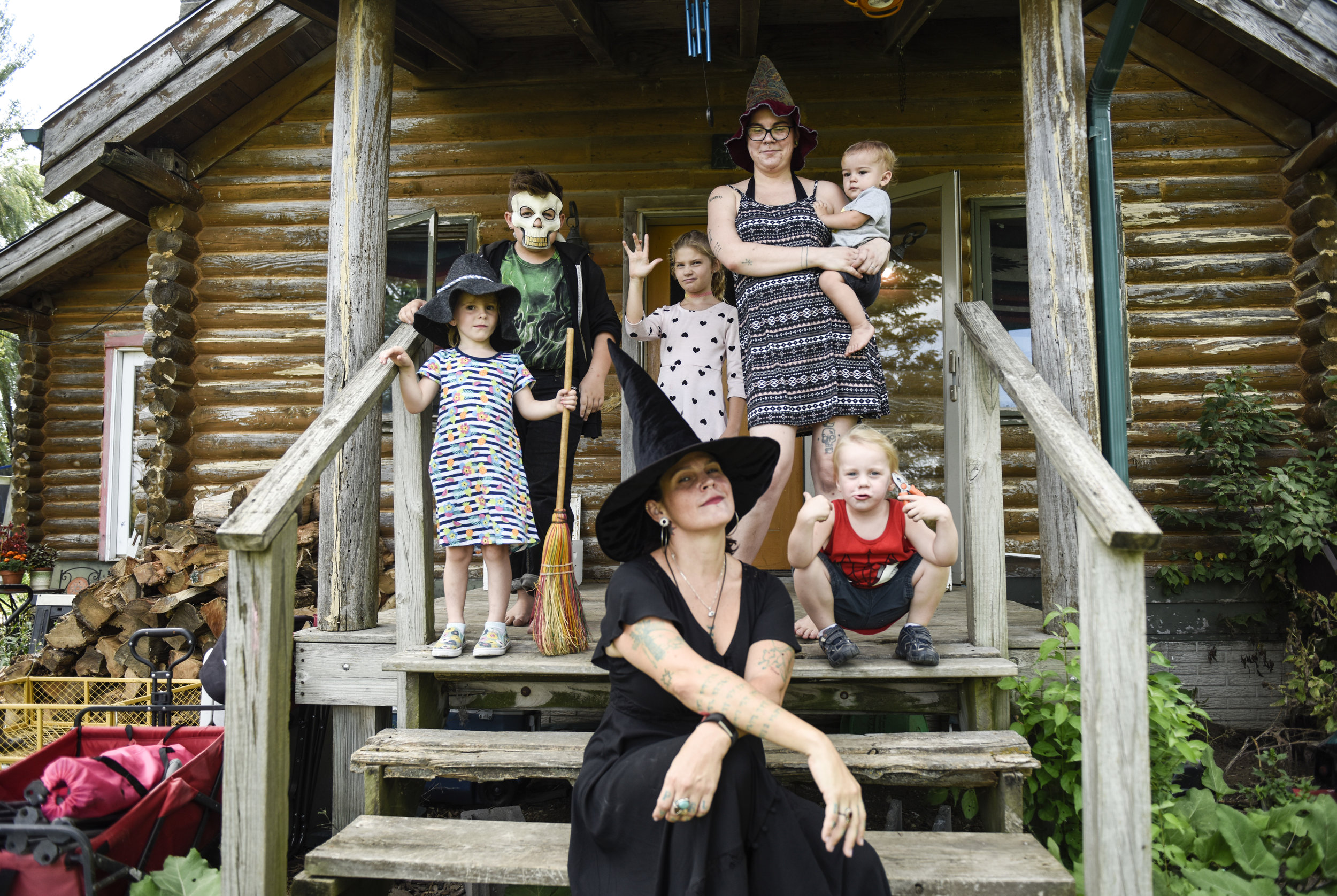  Witch Melanie Hexen poses with her family for a portrait on the front steps of their rural Iowa home on Tuesday, Sept. 4, 2018. Hexen's family is comprised of three generations of practicing witches. 
