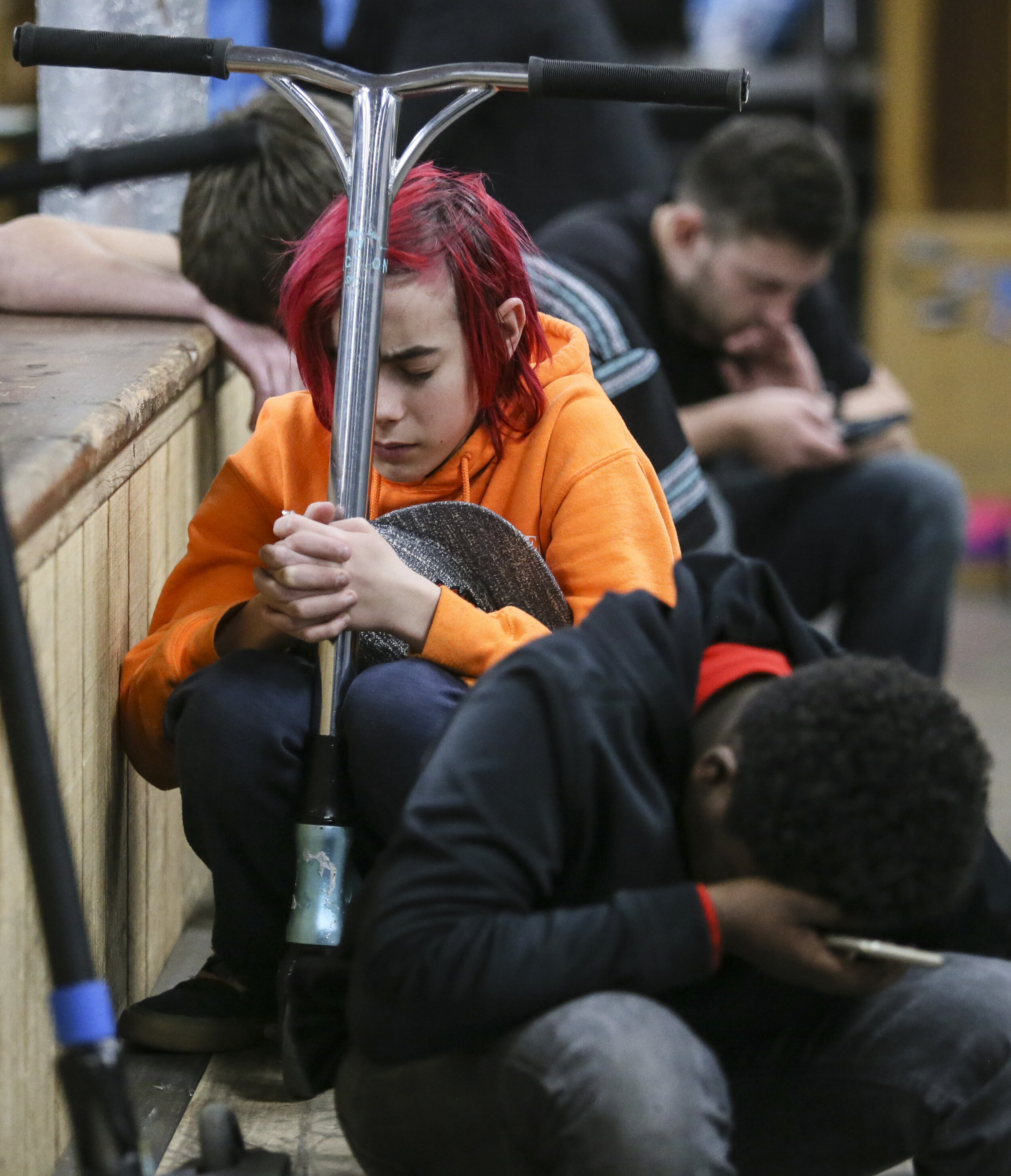  Xander Wassenhove, 14, of Moline, prays hard with scooter in hand Dec. 18 in Davenport after hearing Skate Church is closing. 