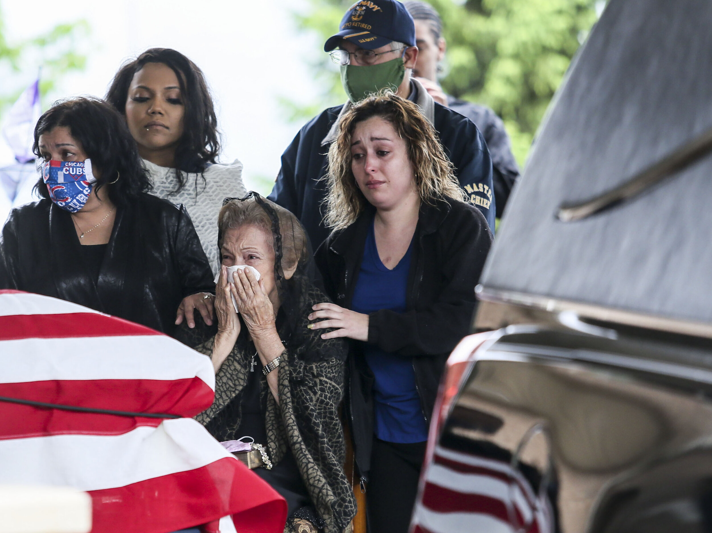  Maria Antu mother of Roberto Antu watches as American Legion Post 246 fold a flag for his wife outside of Rafferty Funeral Home in Rock Island, Thursday, May 15, 2020. 