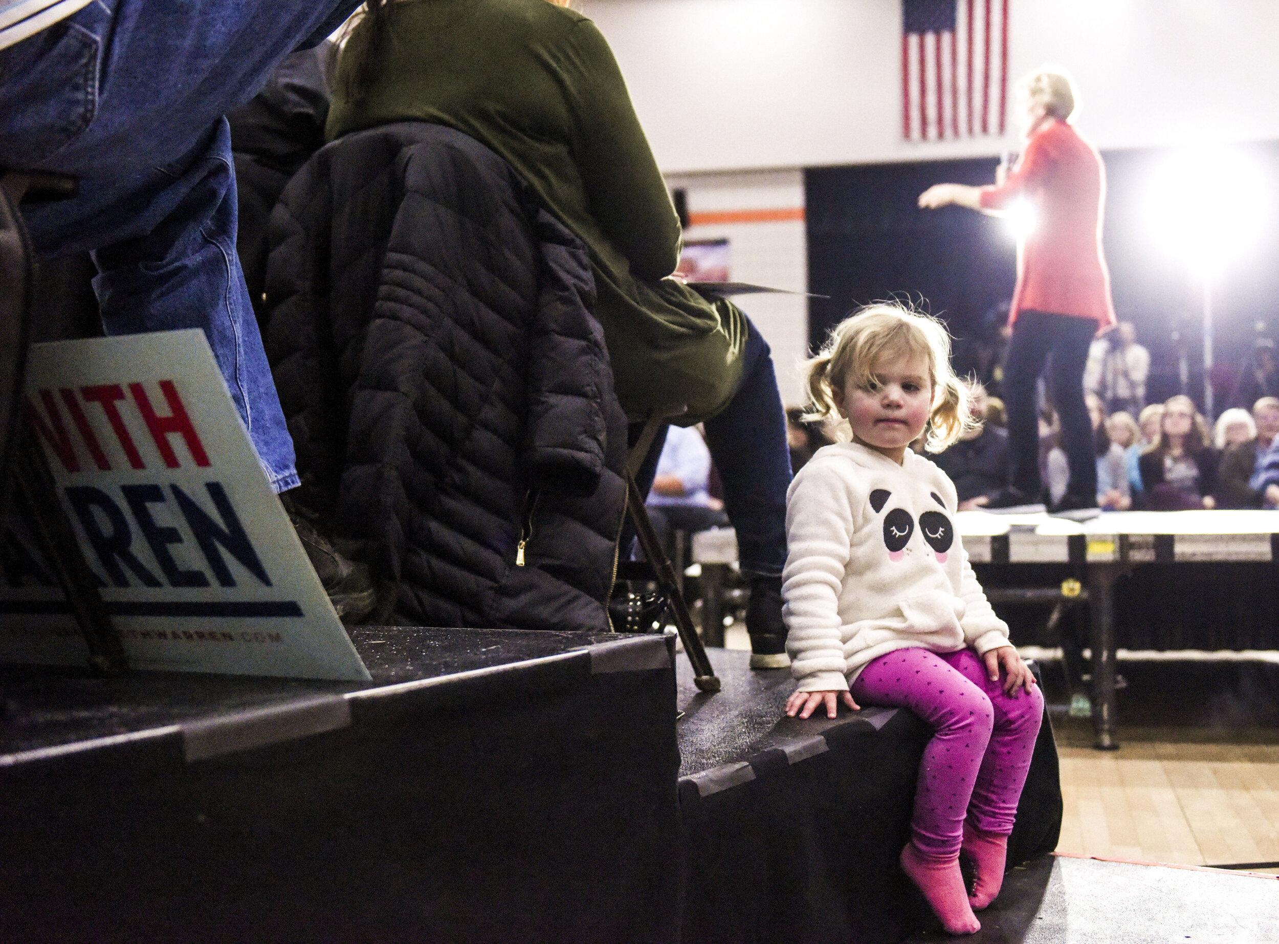  Maggie Kvamme, 2, of Davenport sits next to the stage as Democratic presidential candidate Sen. Elizabeth Warren speaks at Sudlow Intermediate School in Davenport on Jan. 26, 2020 