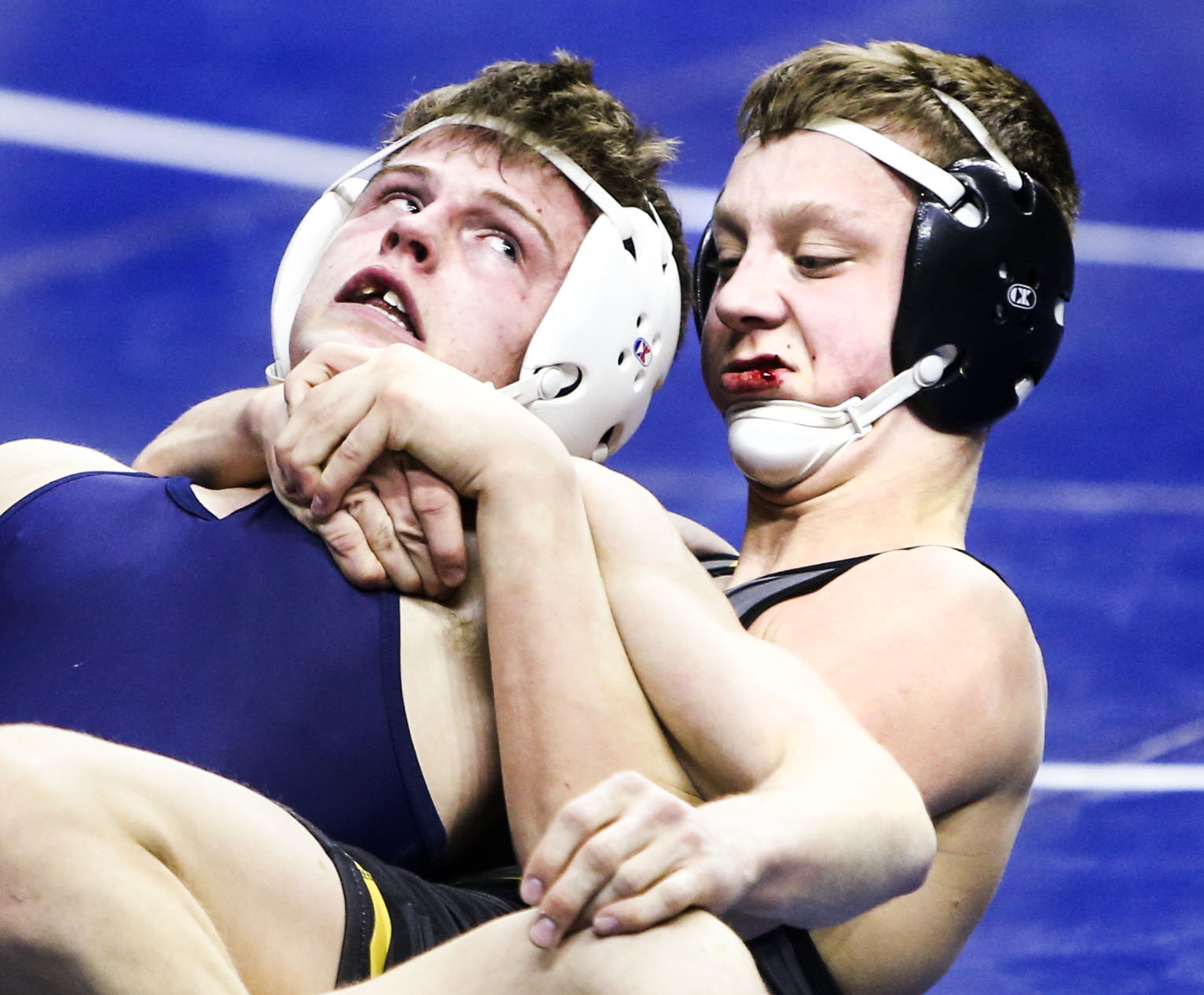 Bettendorf’s Dustin Bohren wrestles Sioc City North’s Nick Walters in the 126 weight class during the 2021 IHSAA State Wrestling Tournament at Wells Fargo Arena in Des Moines, Iowa, Friday, February 19, 2021. 