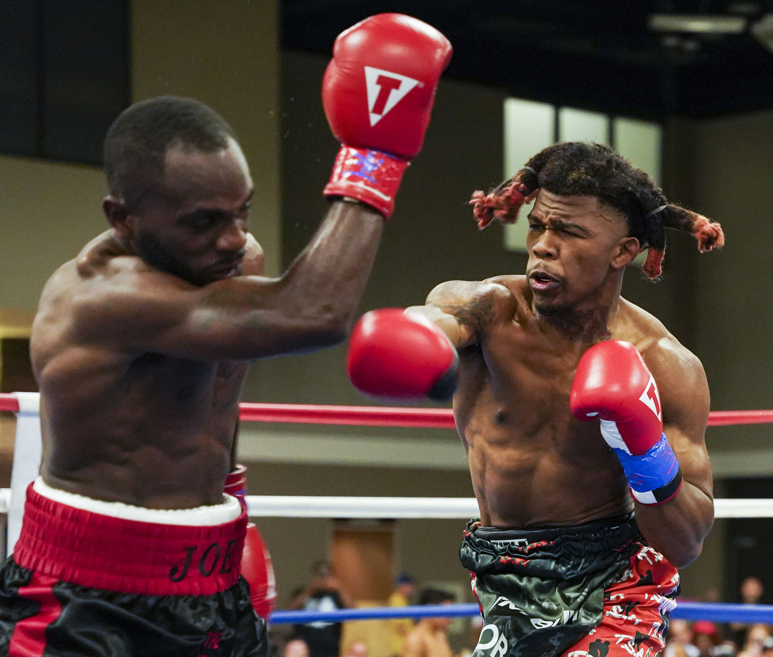  Pachino Hill lands a punch on Jarvis Williams of St Louis during their match at the River Center in Davenport, Saturday, June 19, 2021. 