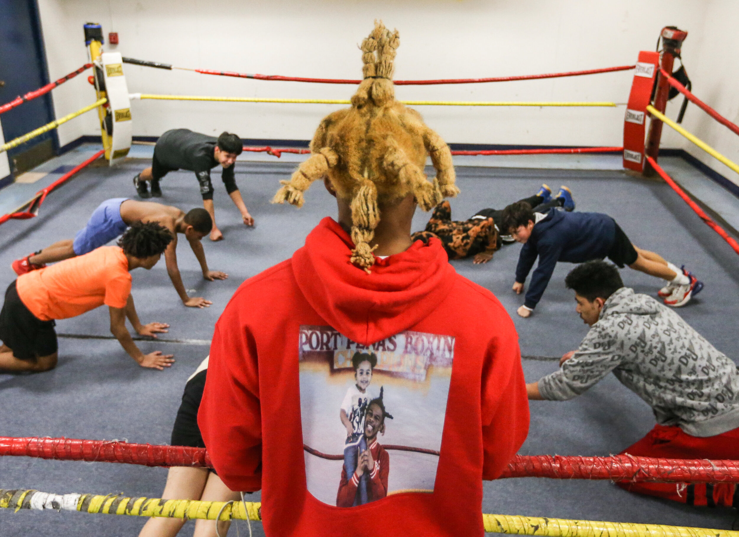  Pachino Hill runs conditioning exercise during boxing lessons for kids at Pena's Boxing Club in Davenport, Tuesday, March 9, 2021. 