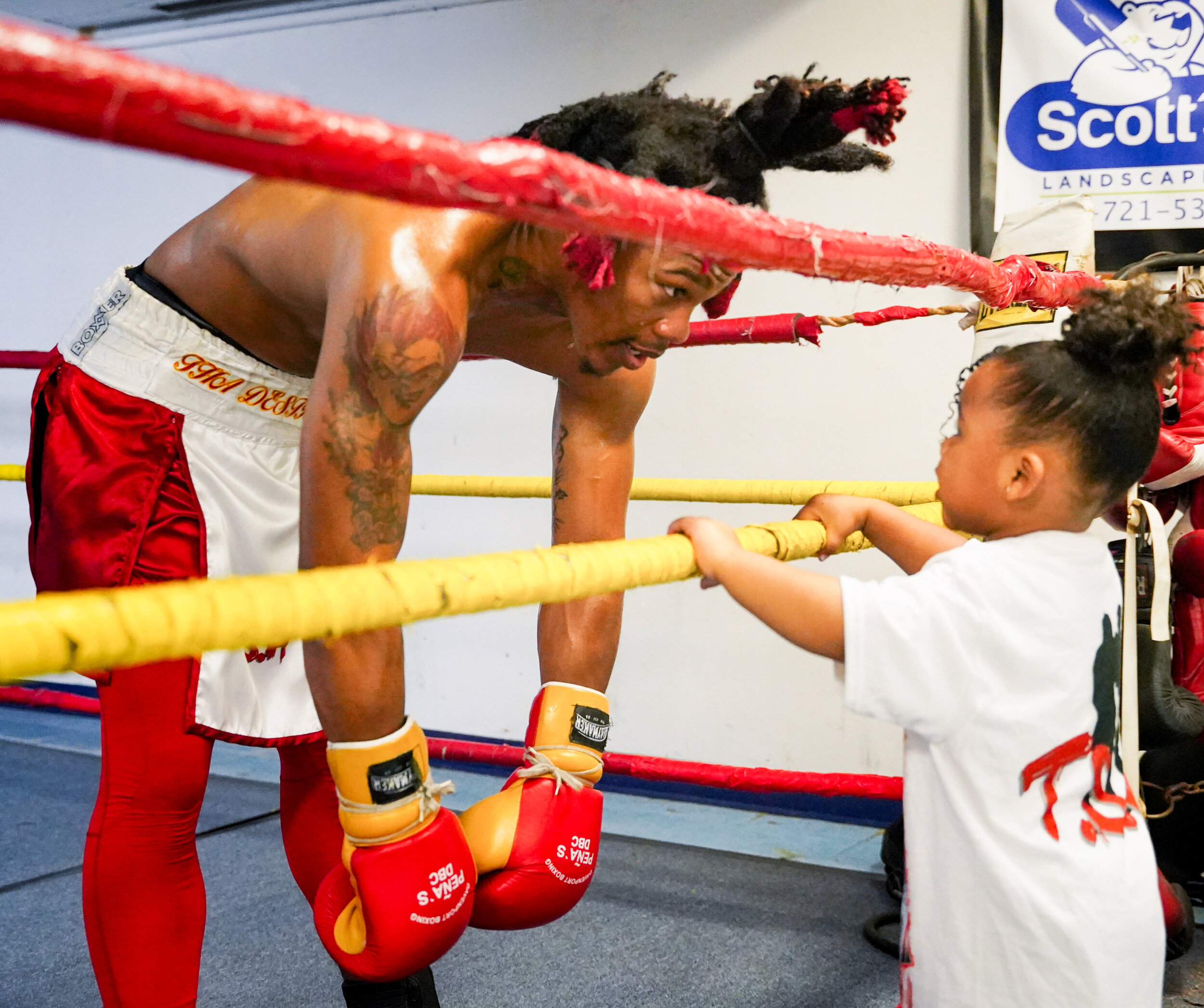  Pachino Hill talks with his daughter Kàlahni Hill after sparring at Pena's Boxing Club in Davenport, Thursday, April 29, 2021. 