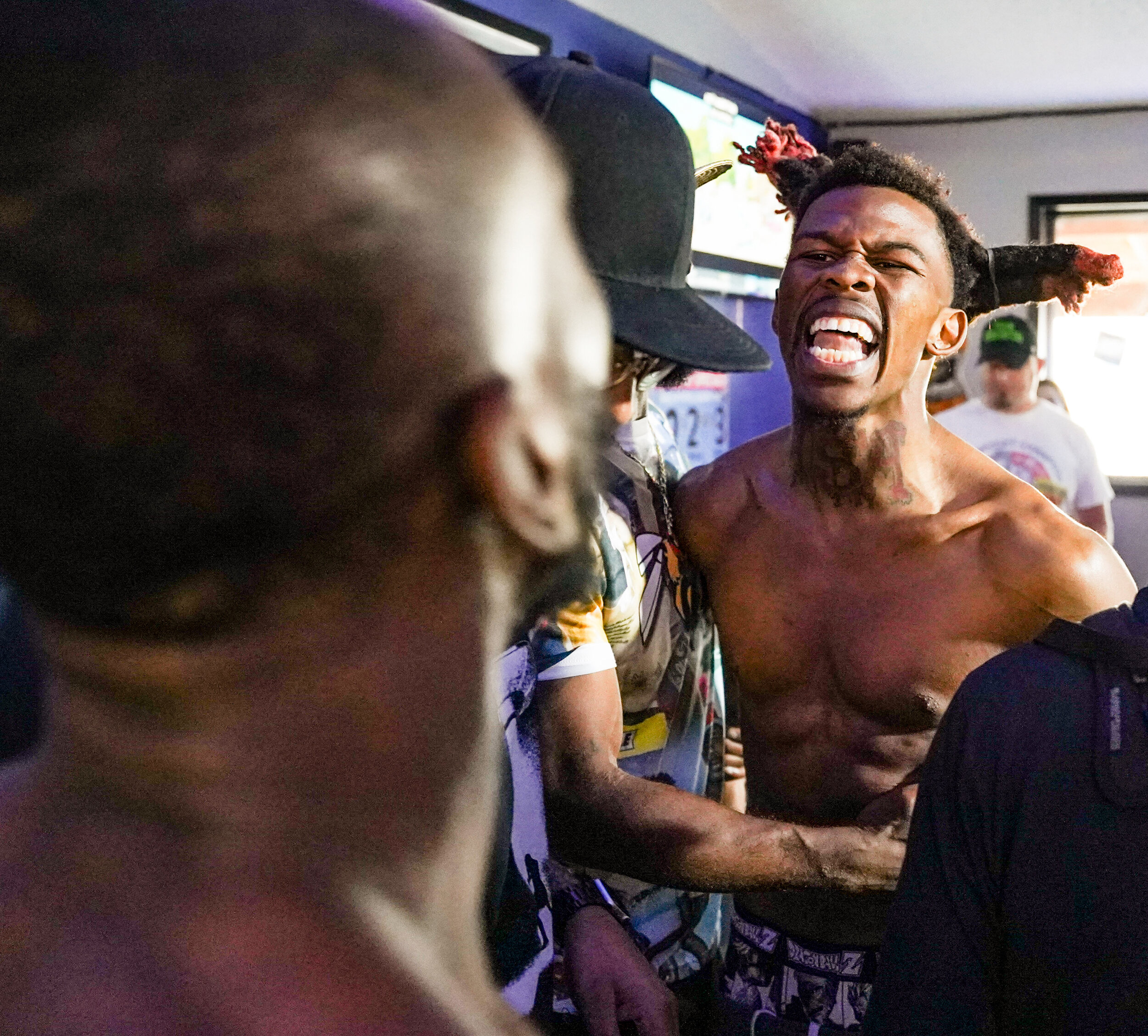  Pachino Hill starts yelling after Jarvis Williams of St. Louis poked his forehead during their weigh-in at Gilly’s Corner Tap in Davenport, Friday, June 18, 2021. 