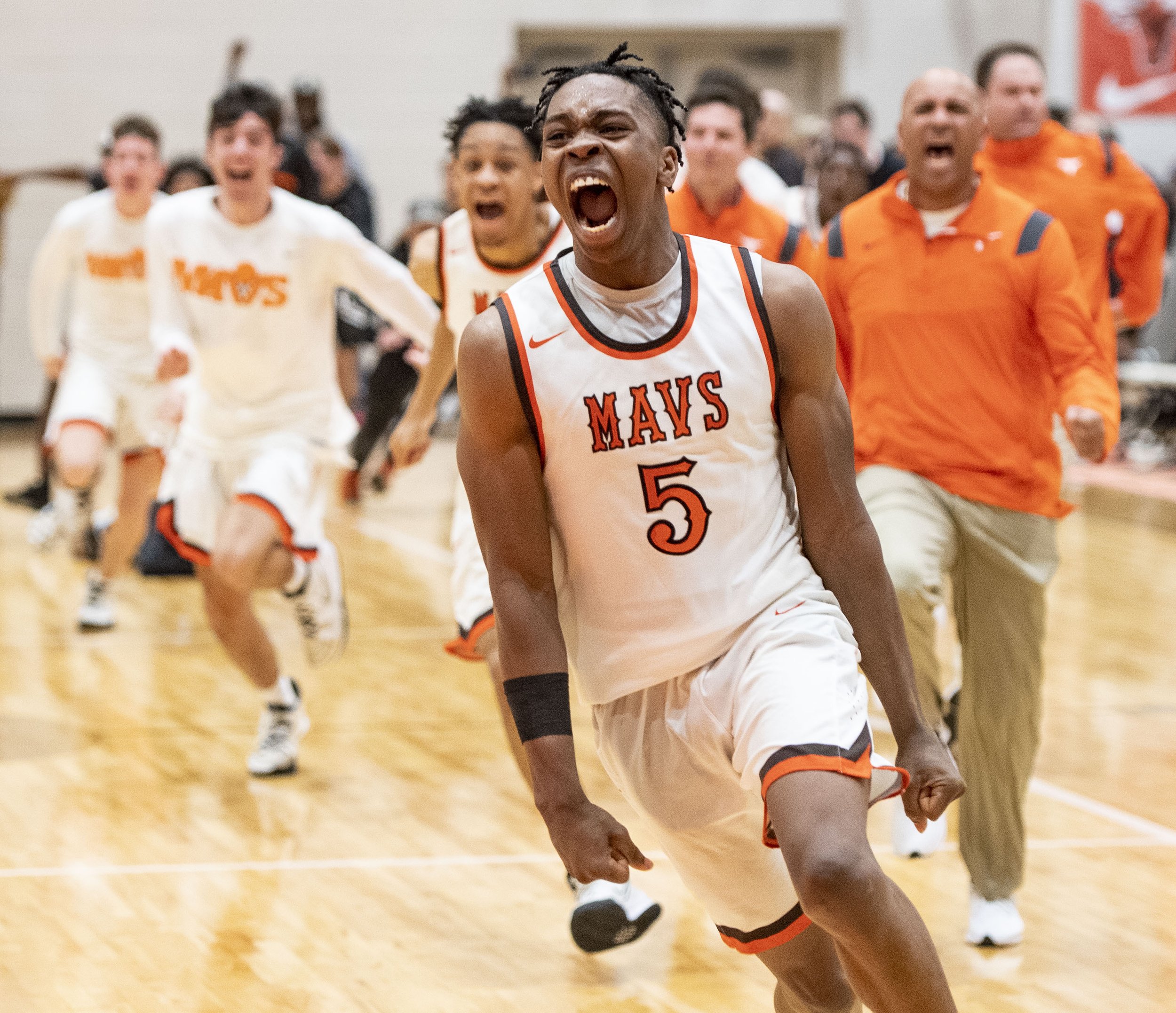 Mauldin's Caleb Byrd (5) leads his team in celebrating after beating Dorman in the Upper State semifinals at Mauldin High School, Monday, February 21, 2022.  