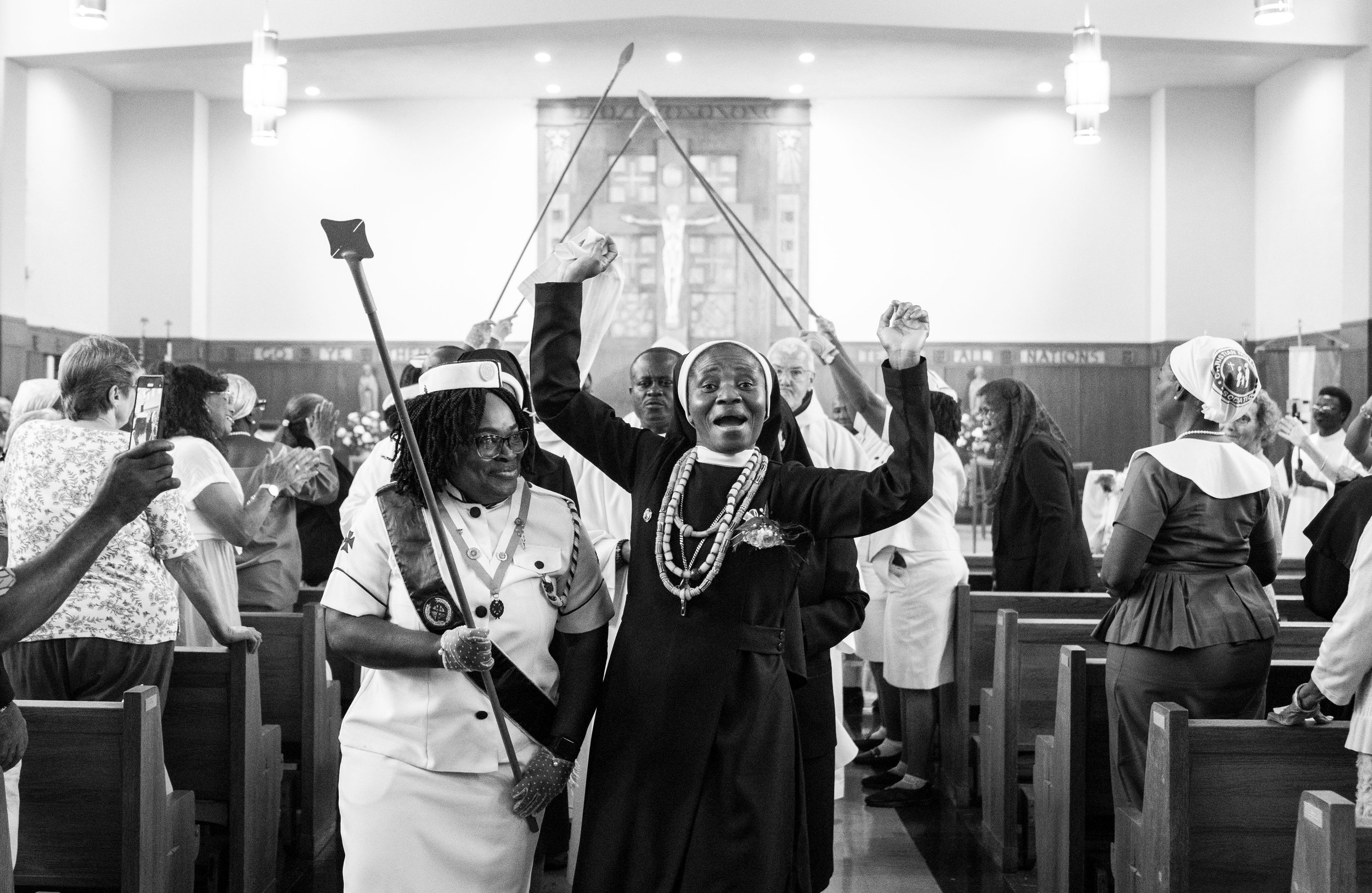  Sister Mary Pauline Tamakloe celebrates down the aisle after taking her final profession at Our Lady of Mount Providence Convent, in Baltimore.  