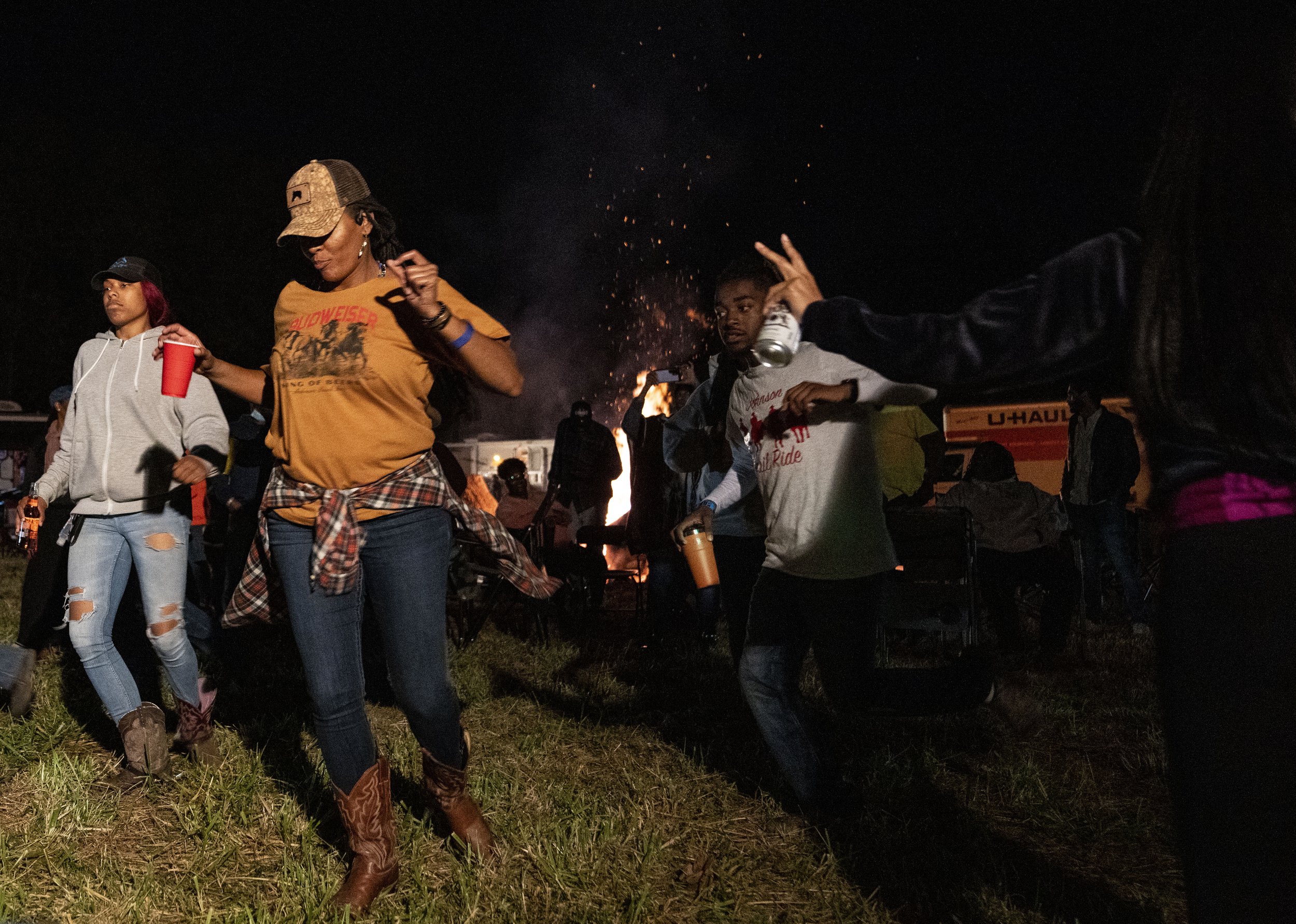  Kisha "KB" Bowles line dances during the Rough Riders Trail Ride and Fish Fry, in Clinton. 