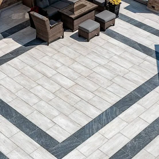 Large concrete patio and outdoor living area with contrasting borders