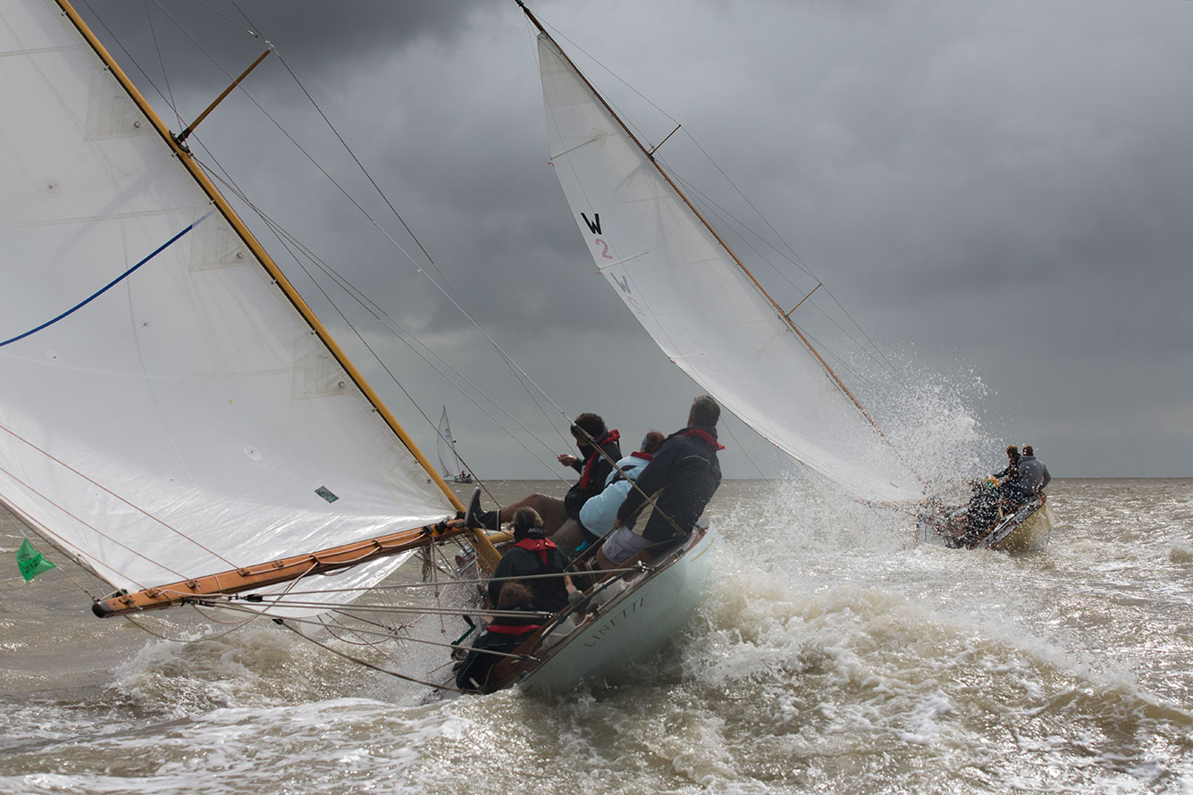 West Solent One Designs: Glen Sampson's 'Linette' to leeward and chasing Adrian Mulville's'Haloween' tail before a gybe mark in 2012's Mersea Week (UK). © Emily Harris Photography